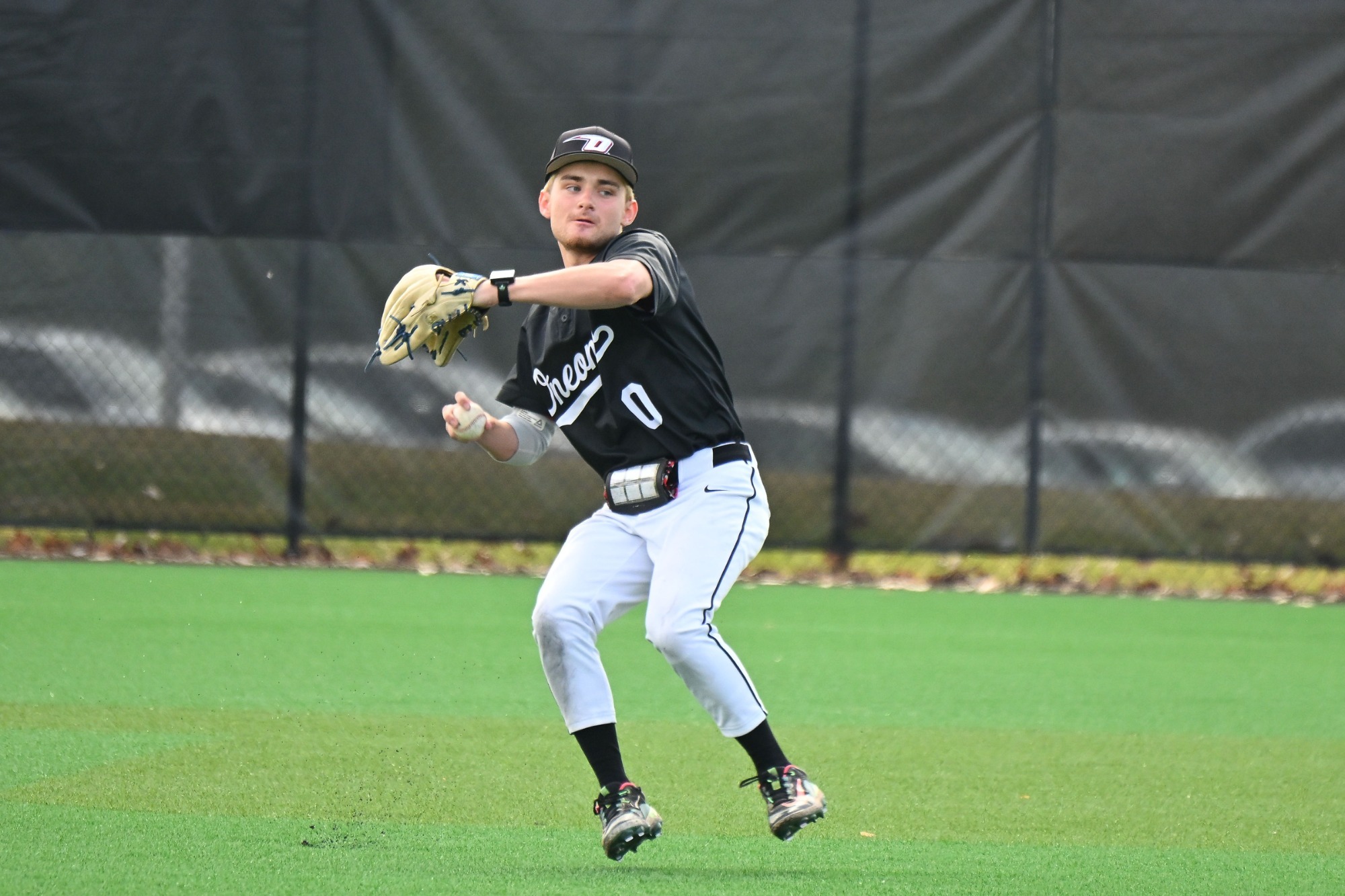 Joseph Monserrat throwing a ball back into the infield from centerfield