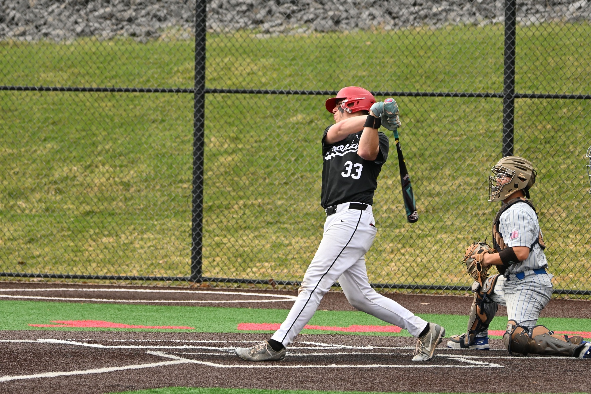 Matt Sandoval follows through on a swing of his bat against Hamilton