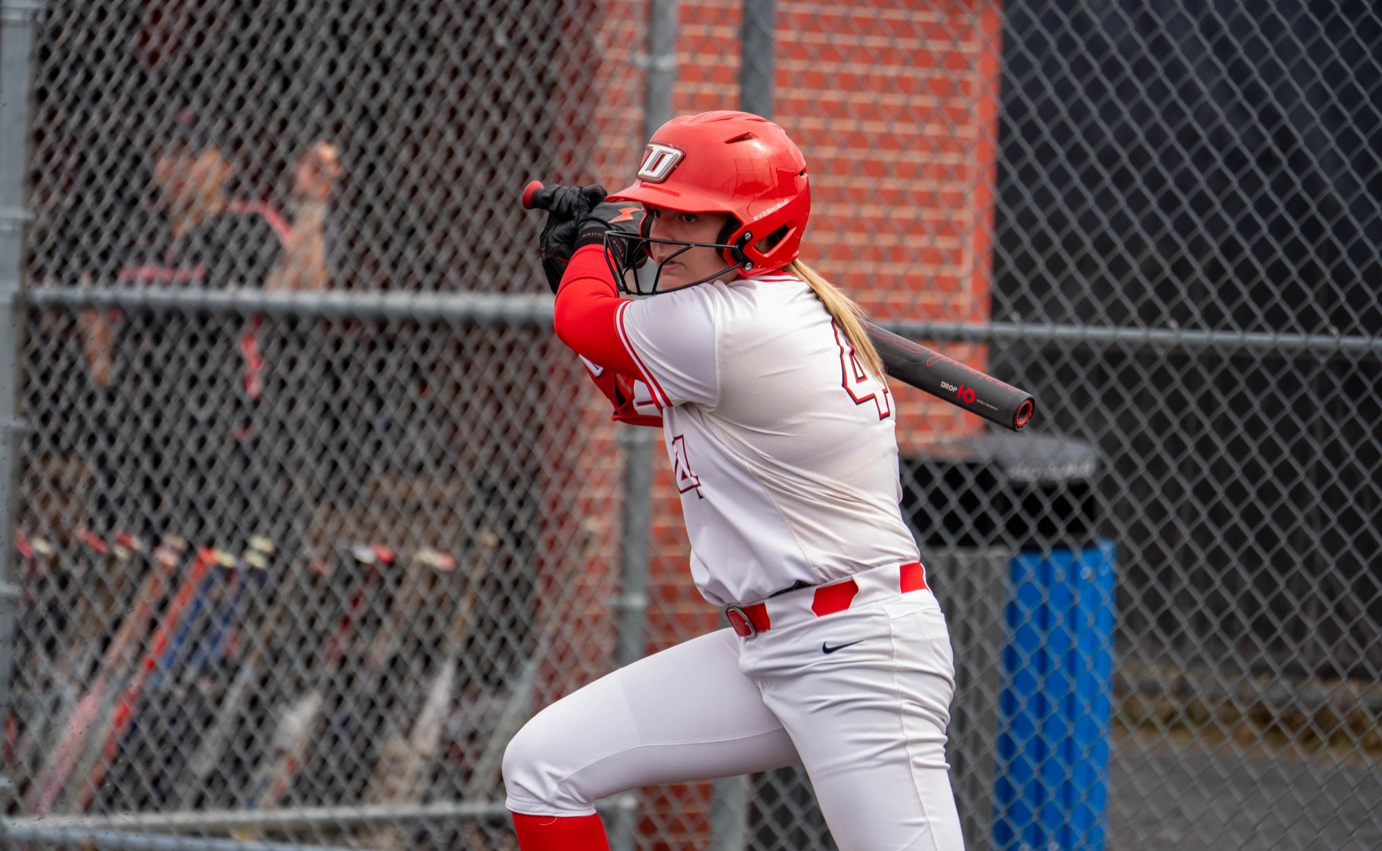 Rylee McGinness finishes swinging her bat against RPI
