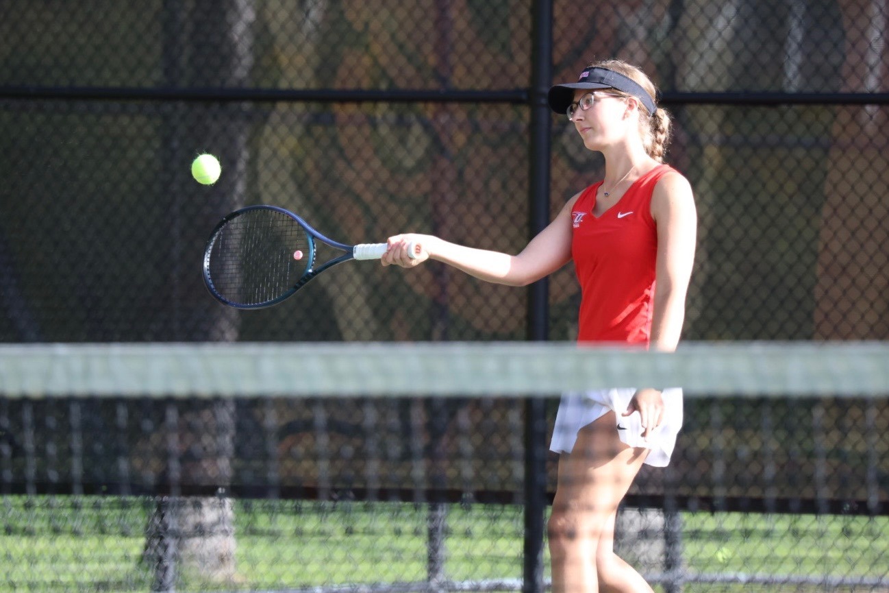 Ashley Glaviano returns a shot in her singles win against Sage