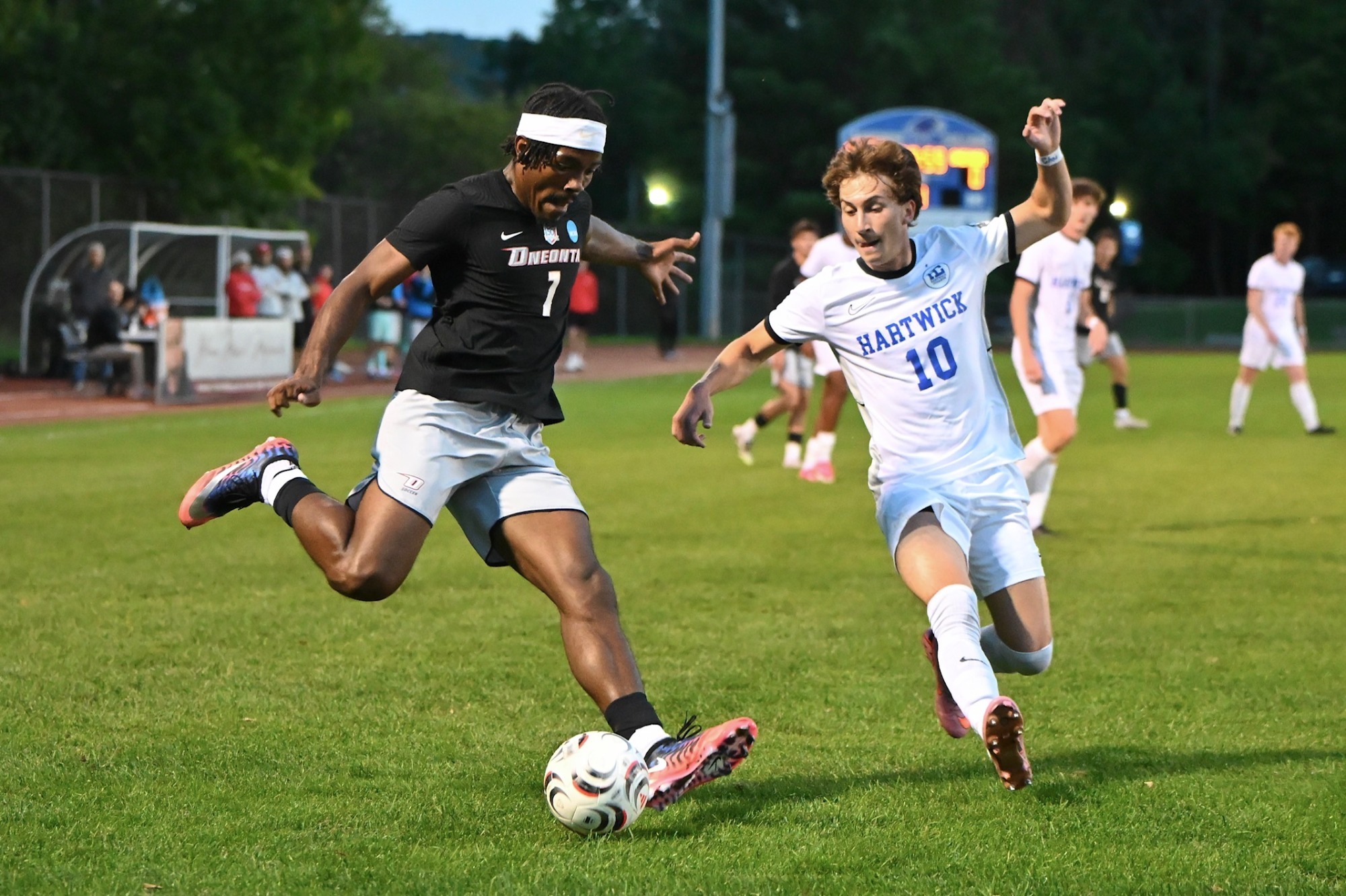 Imari Harris kicks the ball against Hartwick