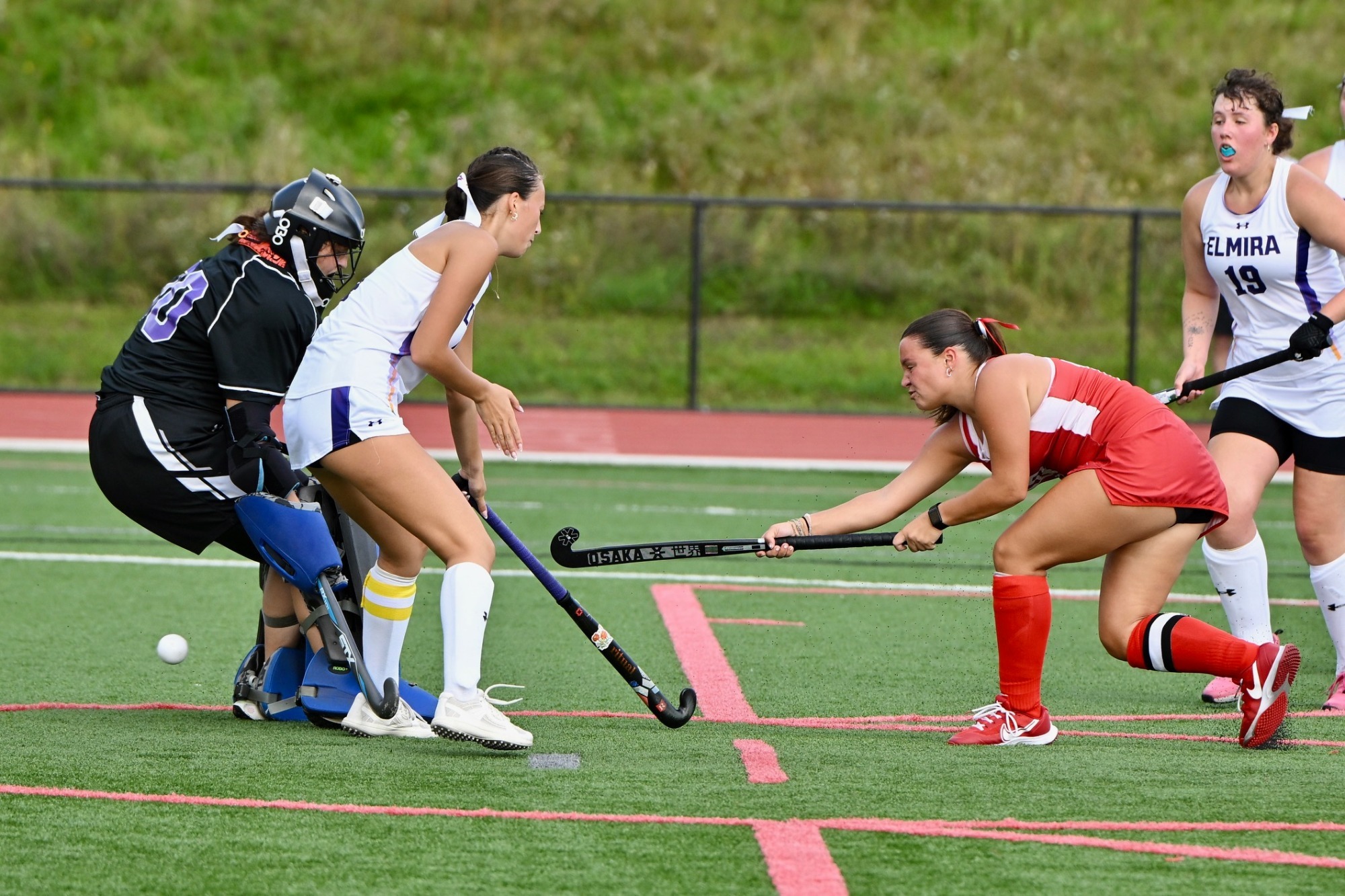 Ali Howell shoots the ball past Elmira's goalie for the goal 