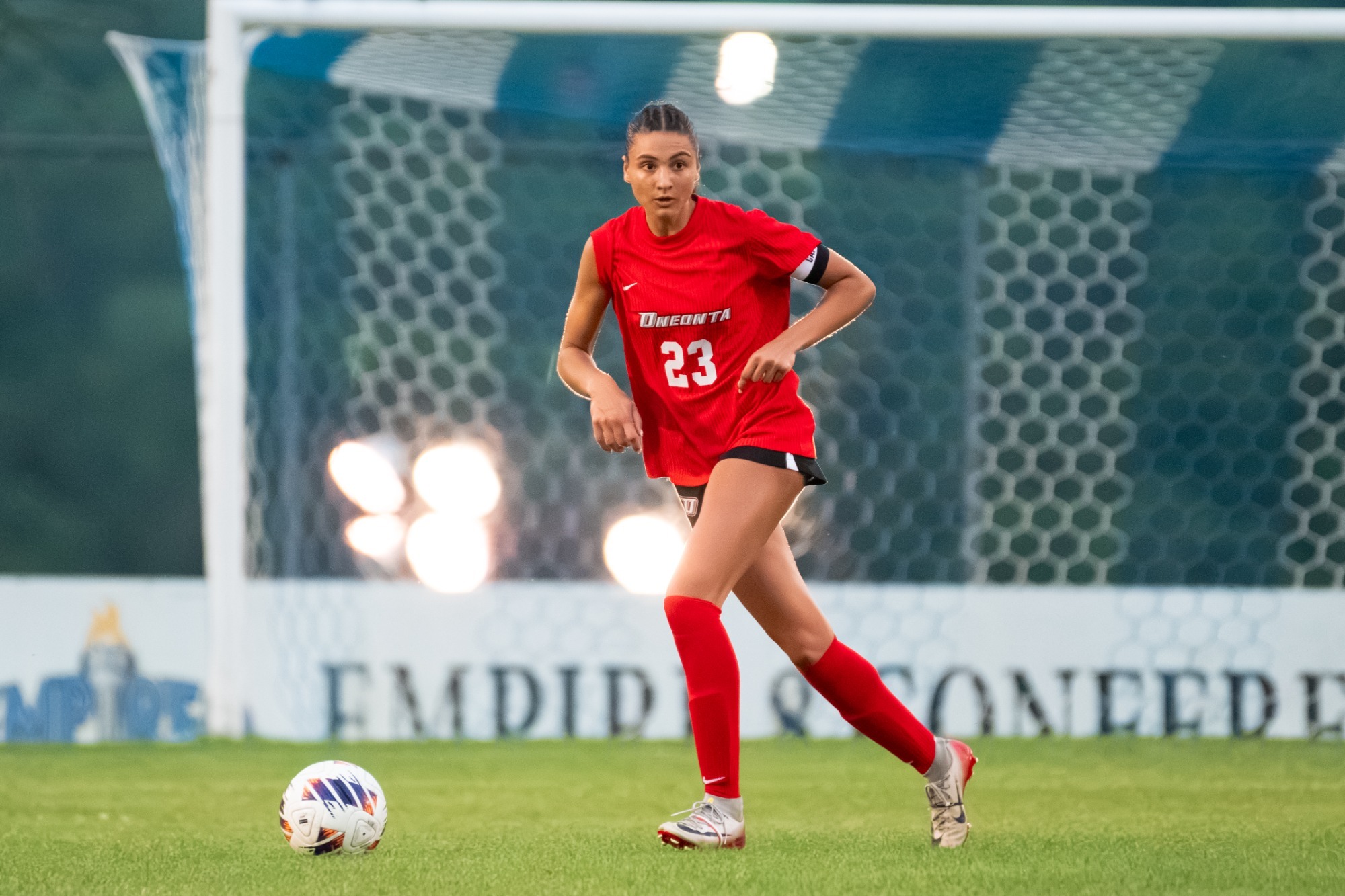 Dominique DiOrio dribbles the ball against Hartwick
