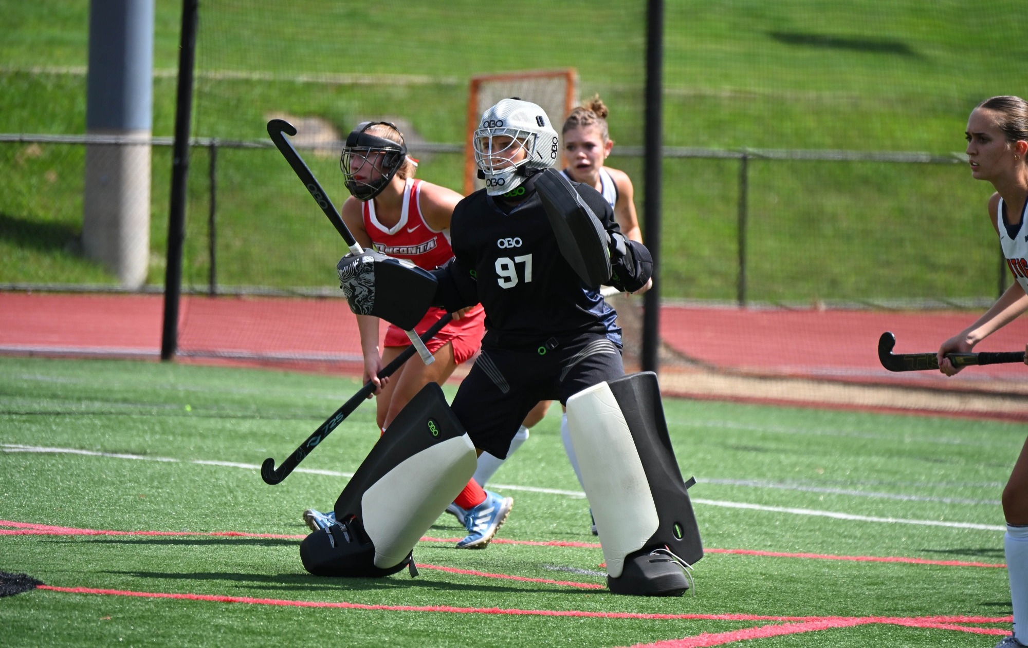 Eva Klessel stands guard in front of the cage against Utica