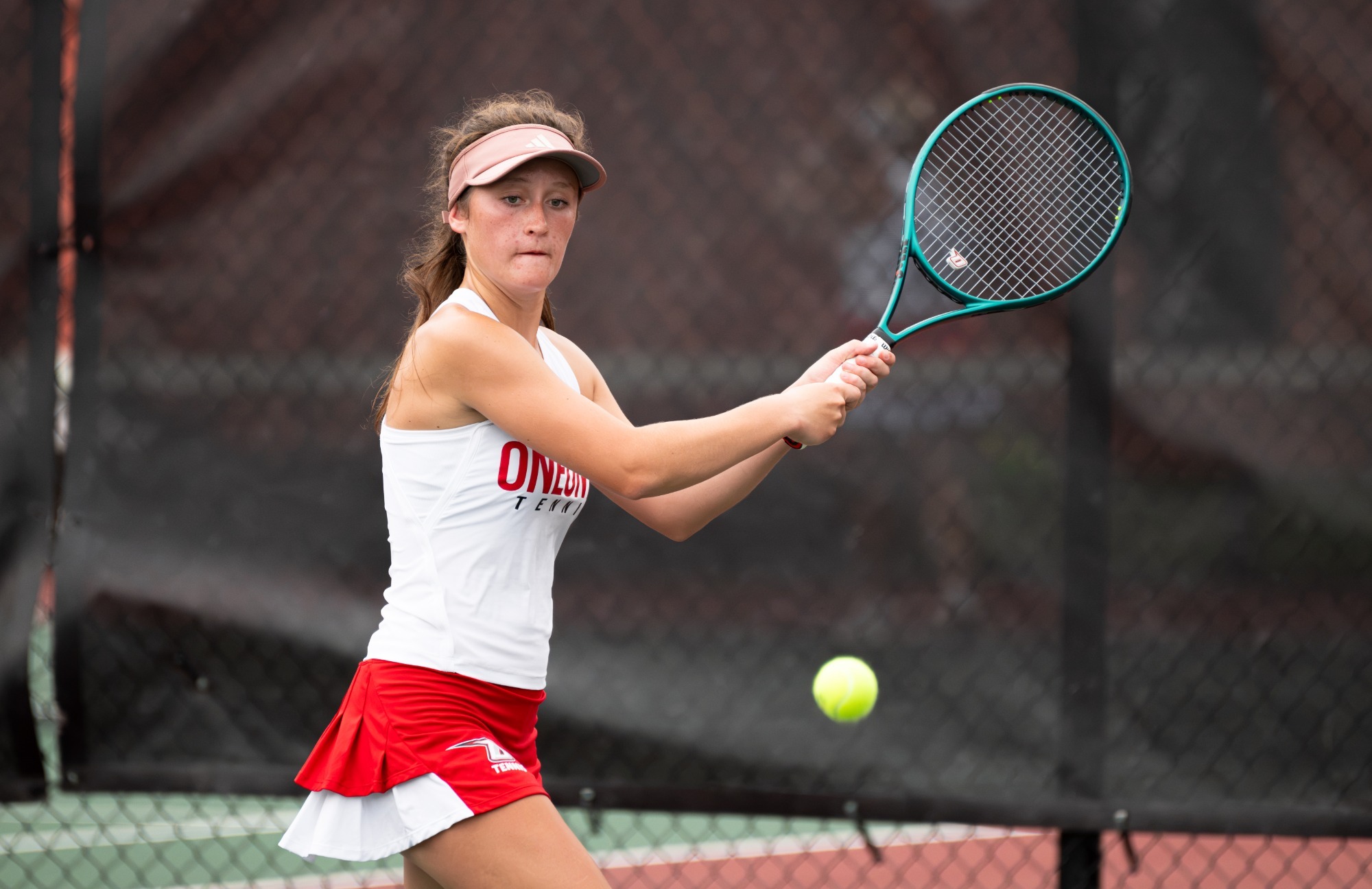 Kaitlyn Jones returns the ball during her first collegiate win 