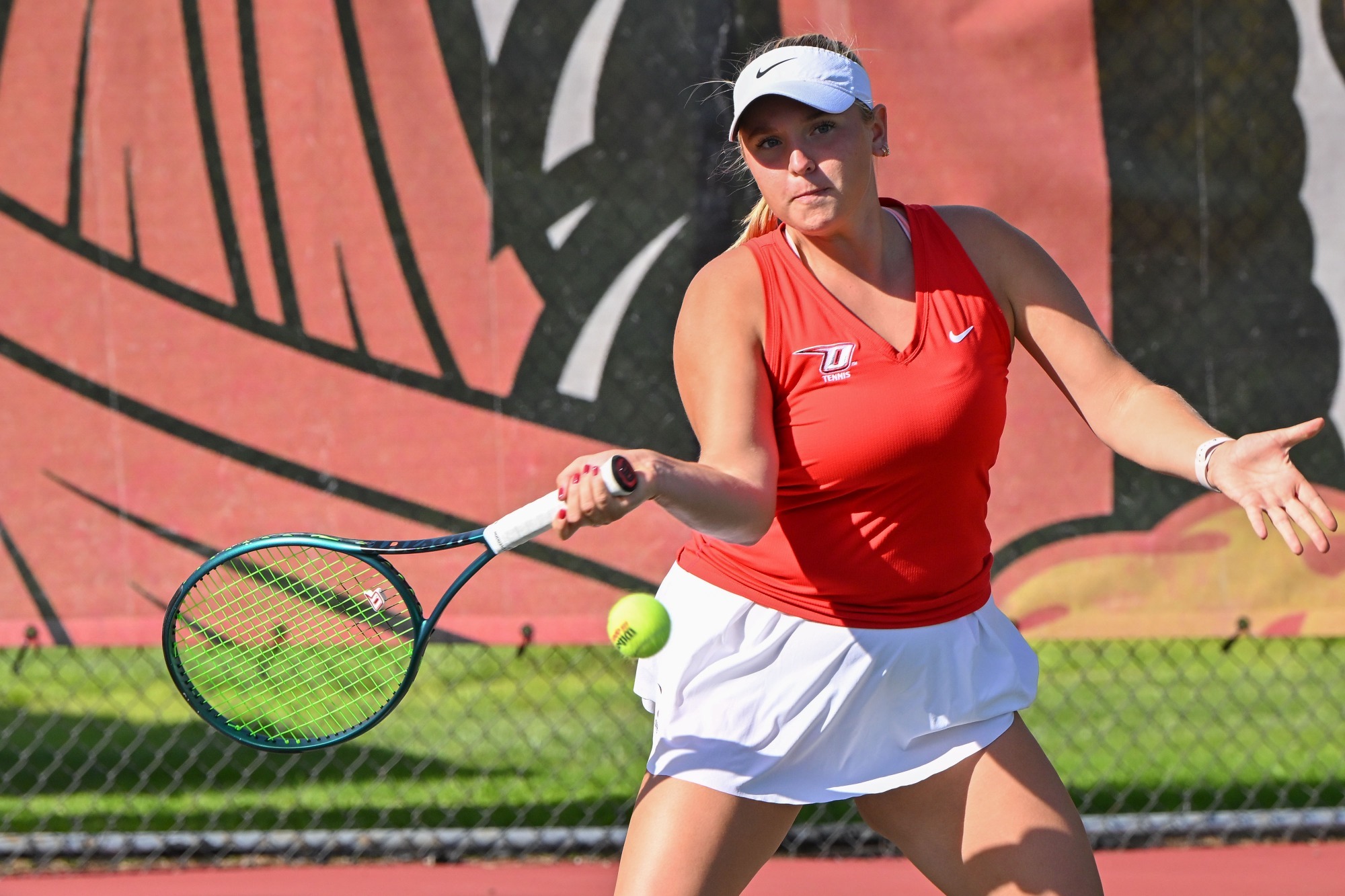Haley Peck returns a shot against Sage