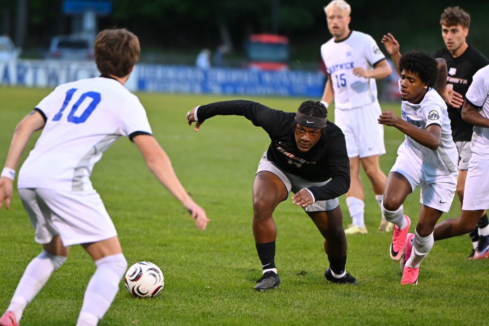 Iyare Harris goes after possession of the ball against Hartwick
