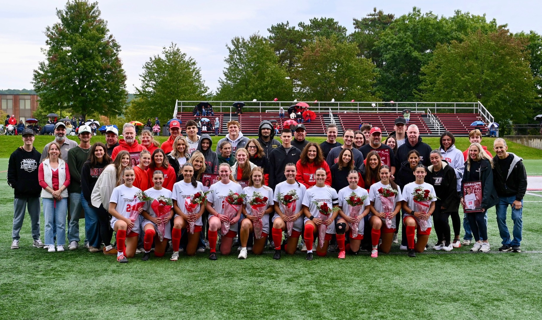 Picture of women's soccer seniors with their family during the 2026 Senior Day