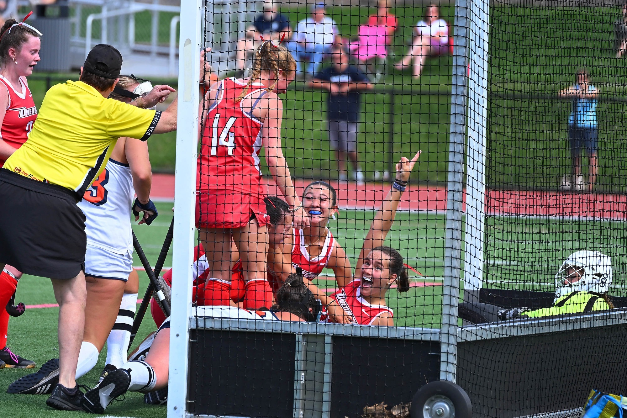 Sarah Stadelmann celebrates scoring a goal with her teammates in season opening win against Utica