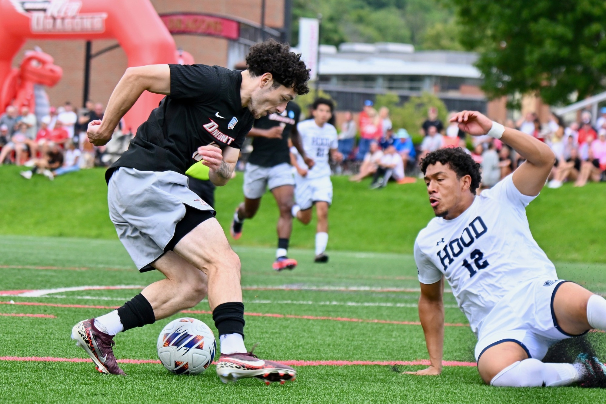 Milton Mancias Magana dribbles past a Hood defender in Mayor's Cup