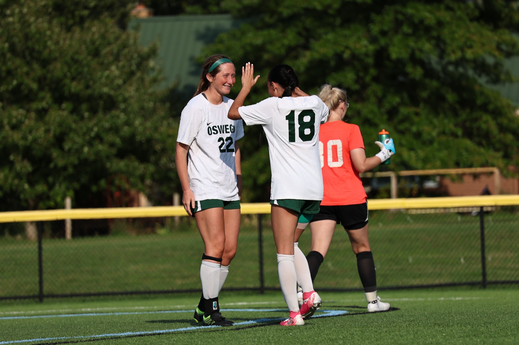 womens soccer celebrating