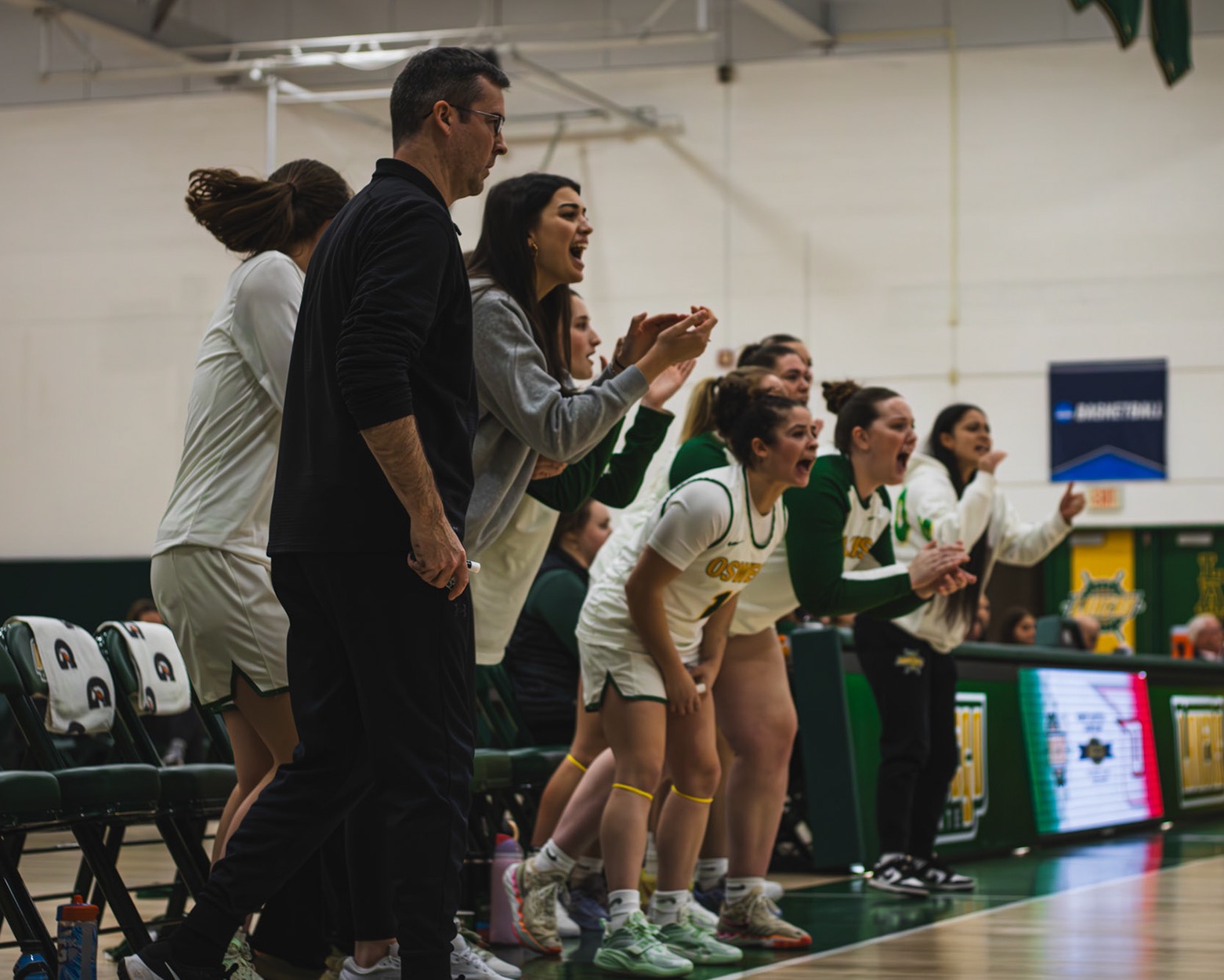 Oswego bench celebrating a made basket