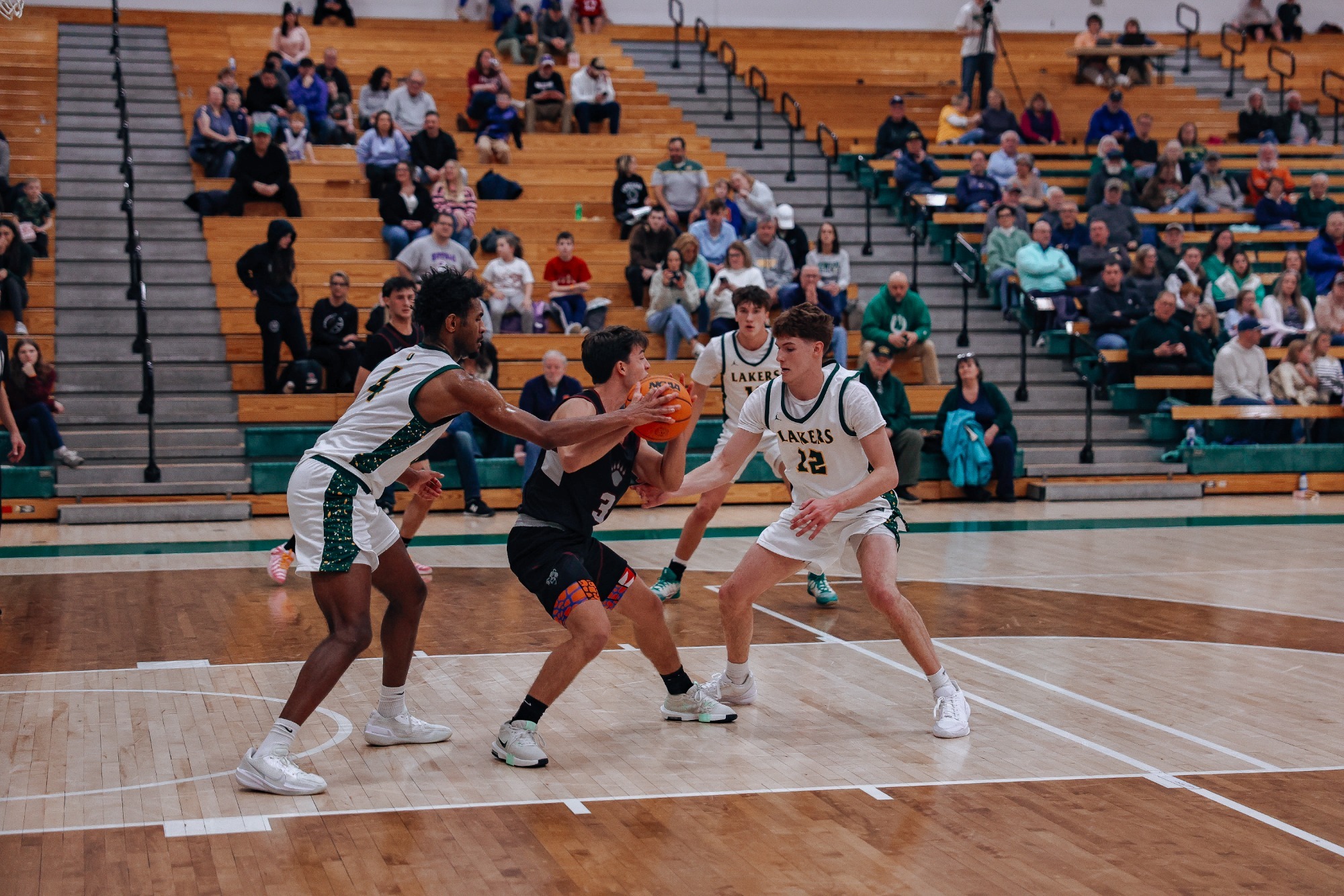 mens basketball playing smothering defense