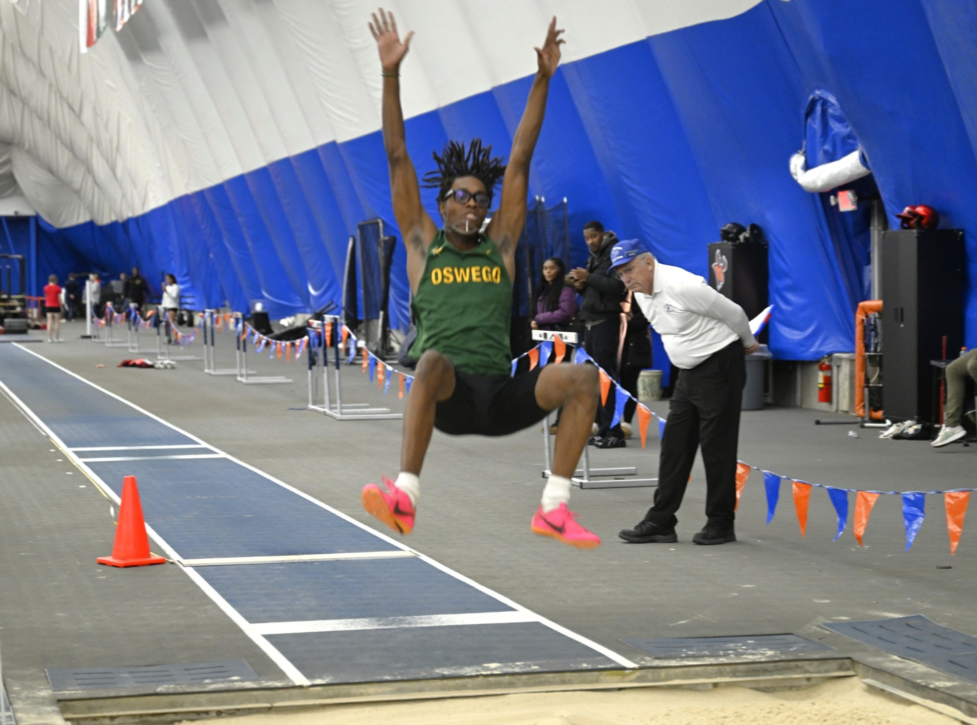 Laker athlete performing long jump 