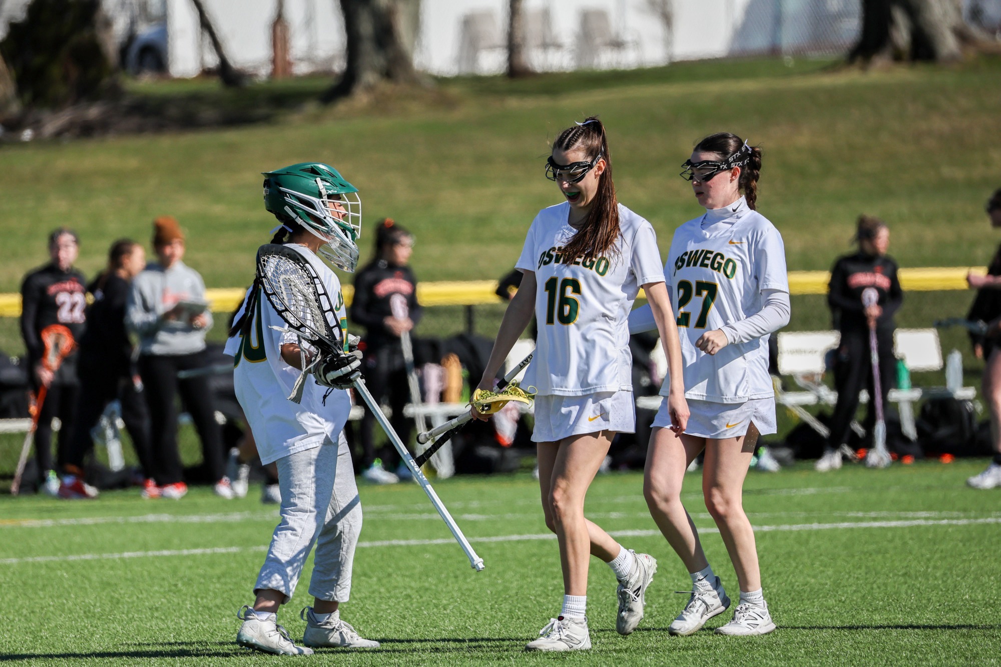 Womens lacrosse celebrates a goal