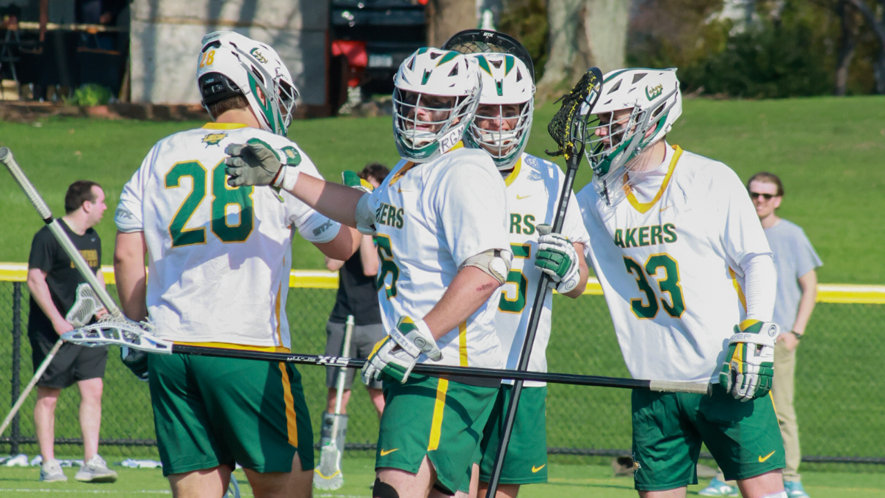 mens lacrosse in a huddle