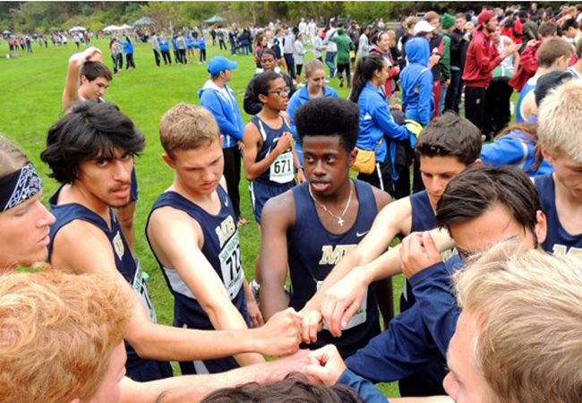 Cross Country Men Huddle at USF 