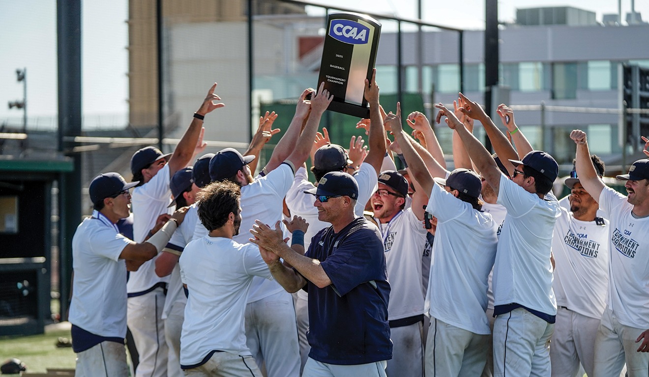 Otter Baseball hoisting the 2025 CCAA Tournament Championship Trophy