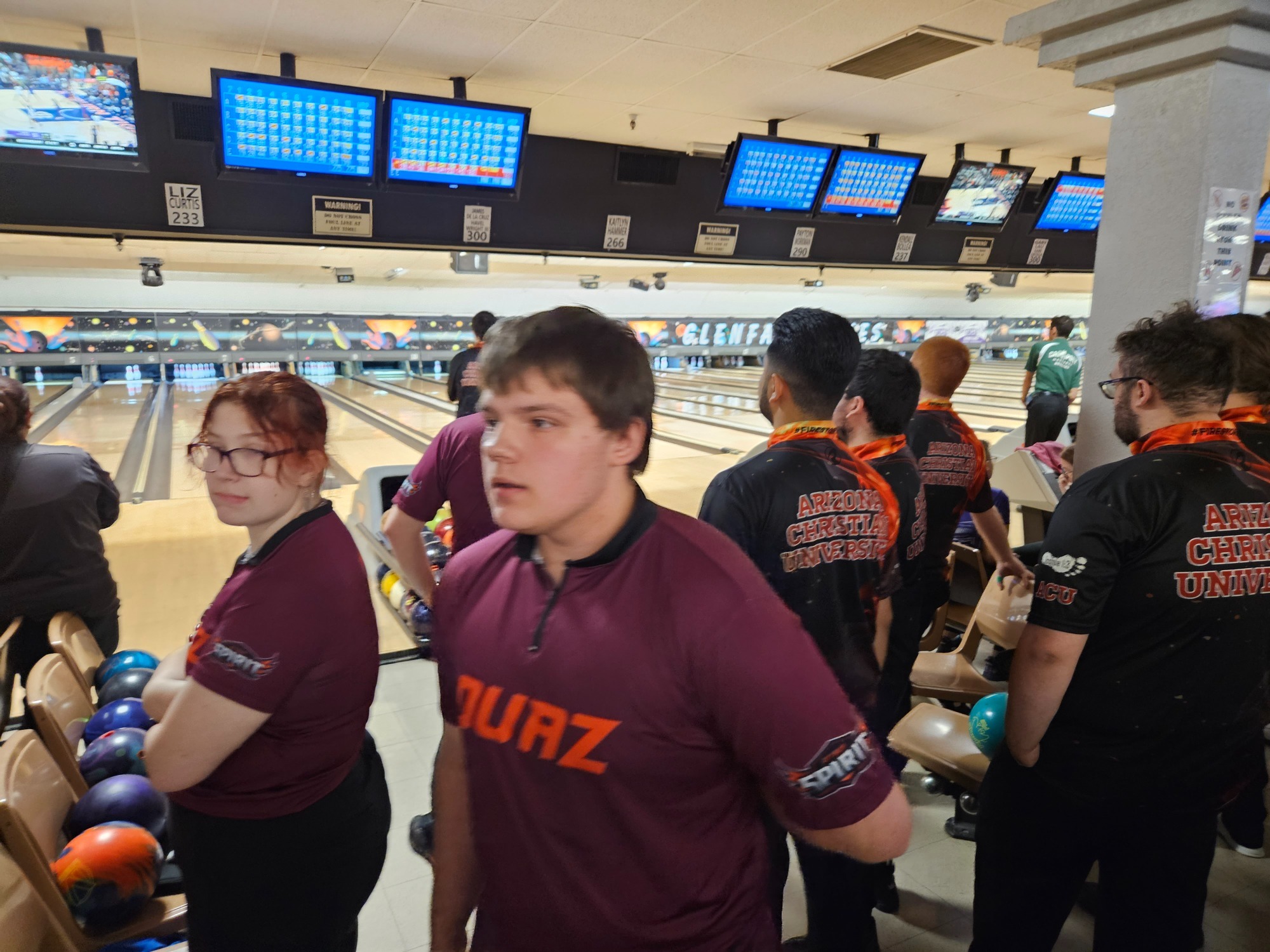 Garrett Plum talks to teammates about the last frame during the Antelope Shootout. 