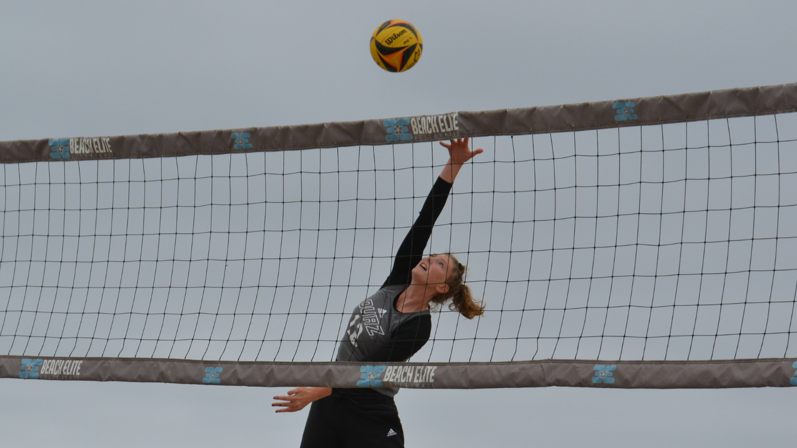 Summer Hanks takes a swing at the ball during the 2024 GSAC Beach Volleyball Championships