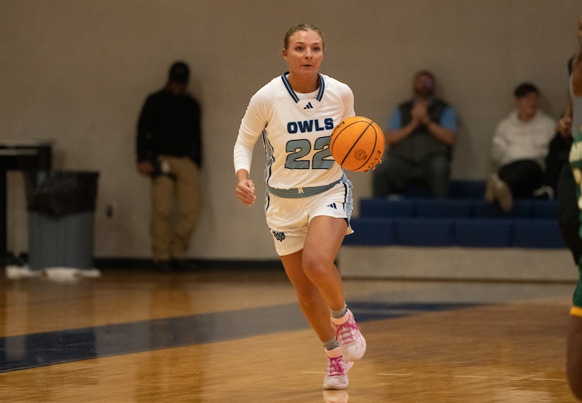 Conley Langford brings he ball up court