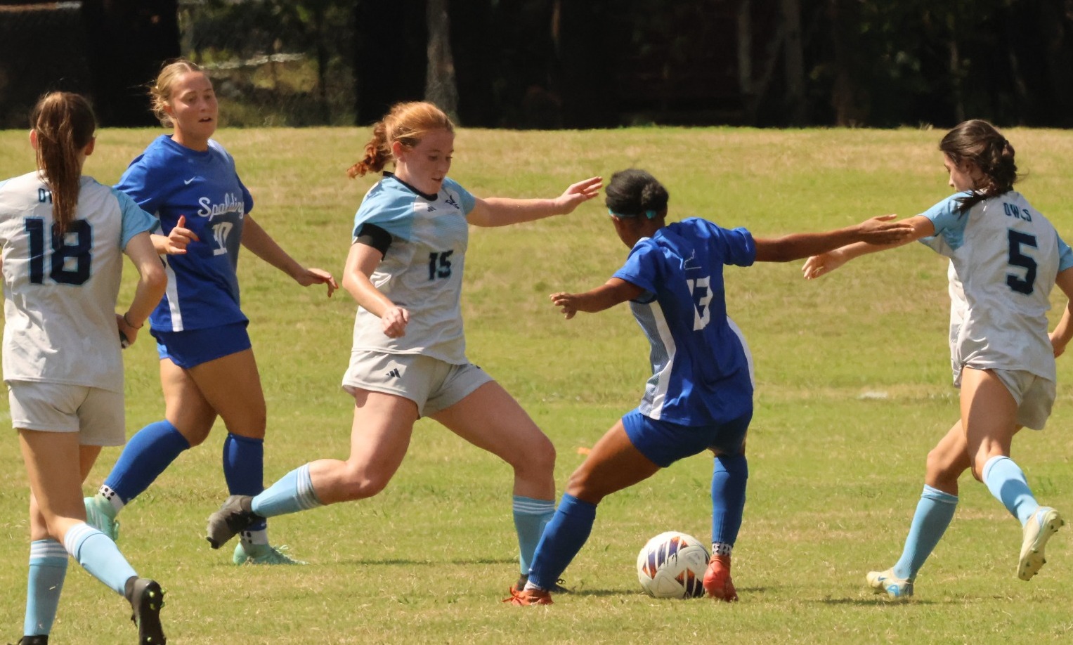 Emma Hall defends the ball