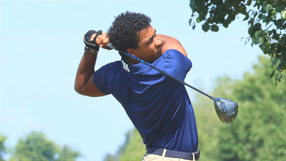 Cameron James hits a drive