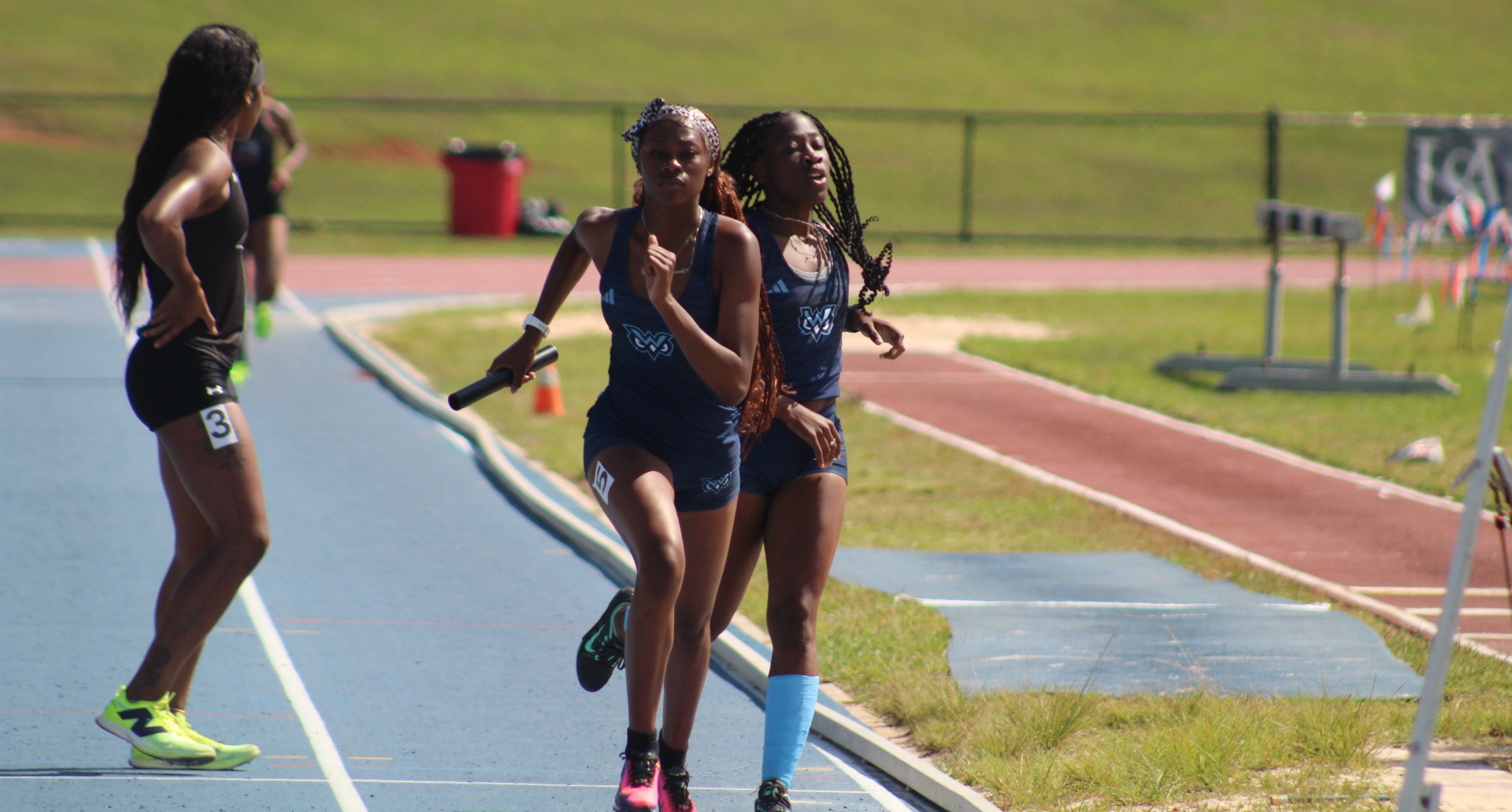 The W women's 4x400 relay team competing on April 11, 2026