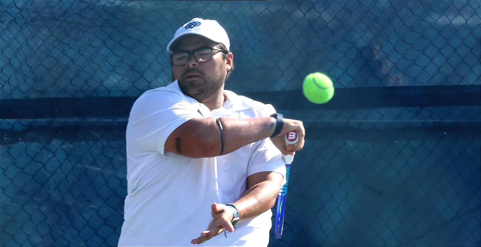 Tennis player Jorge Ortiz Catala returns a ball