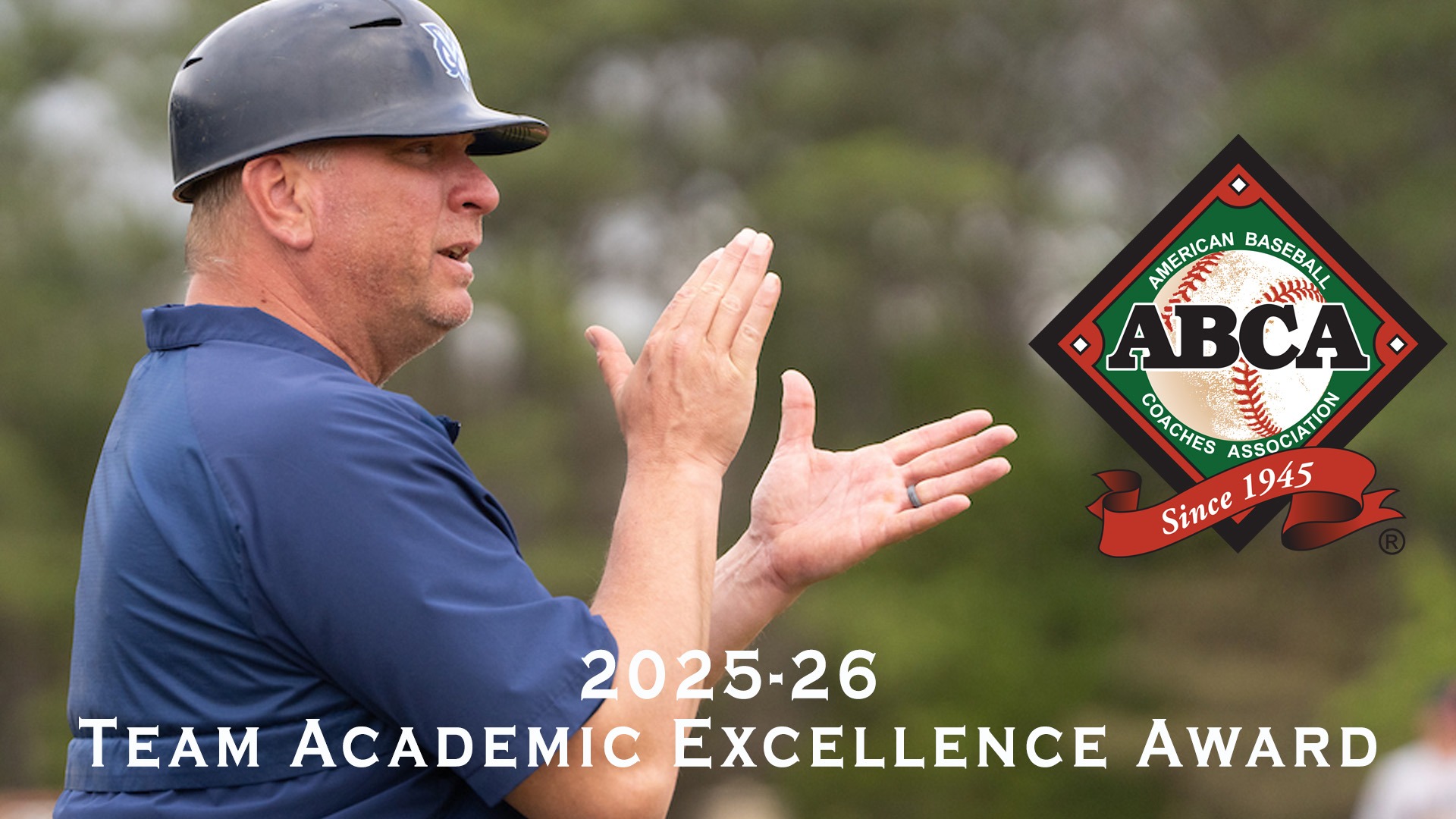 MUW head coach Scott Mularz clapping