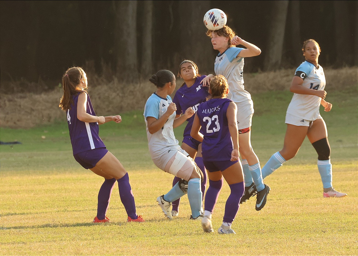 Presley Andrew heads the ball