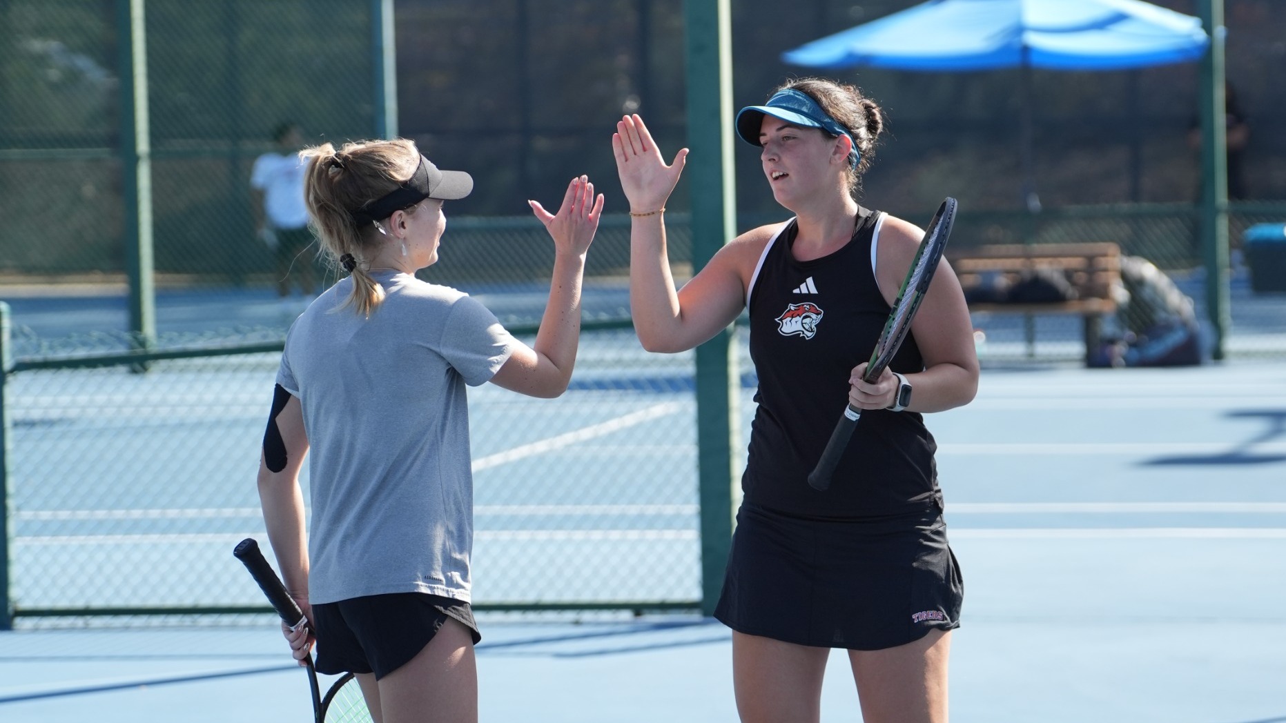 Greta Nagy and Elina Shalaev high five each other