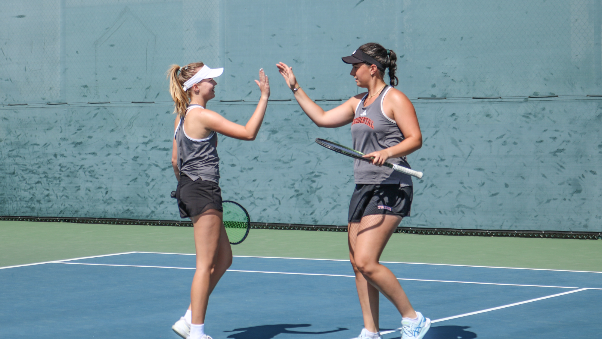 Elina Shalaev (left) and Greta Nagy (right) high-five after a point