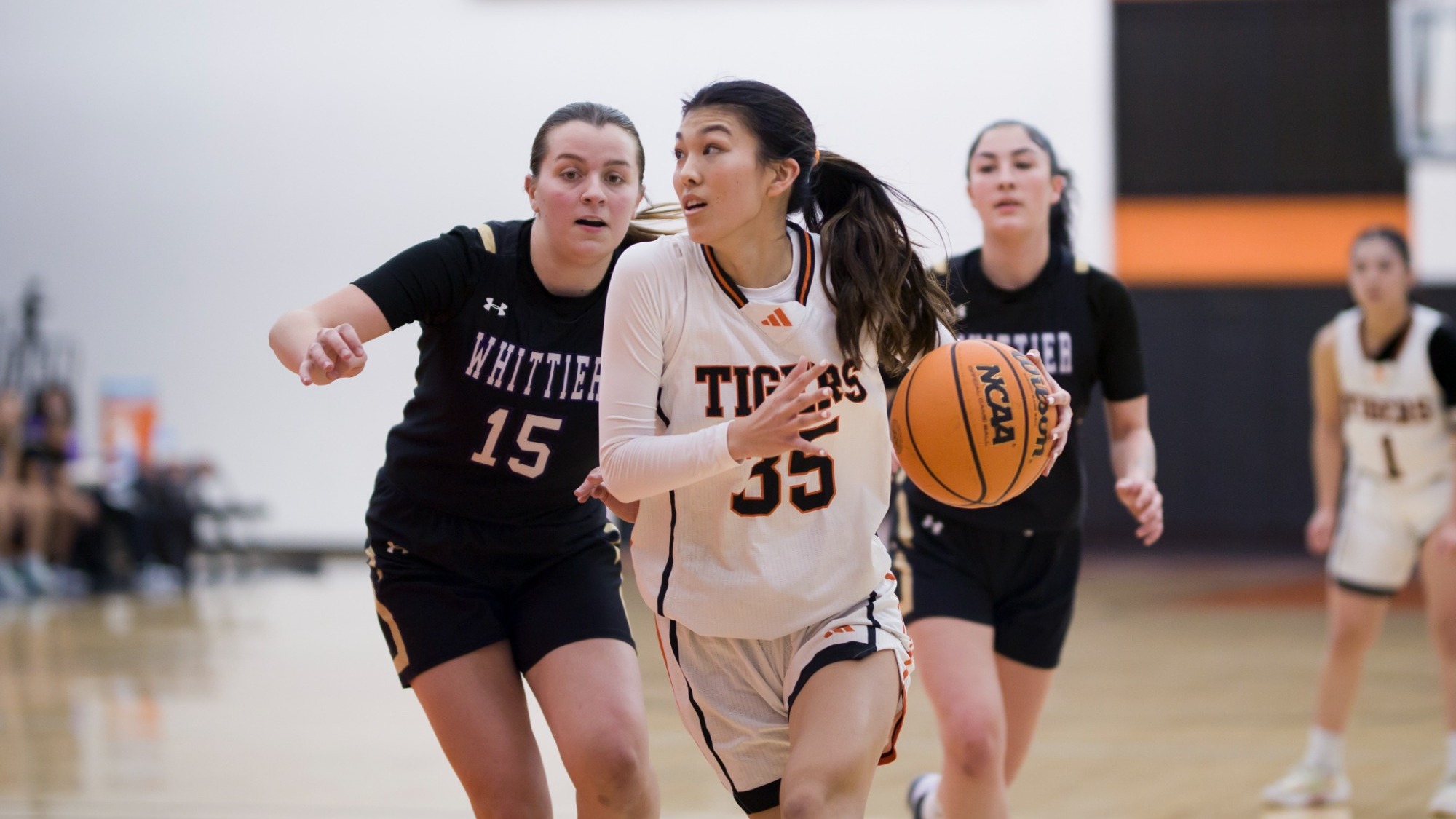 Paige Yasukochi drives to the basket