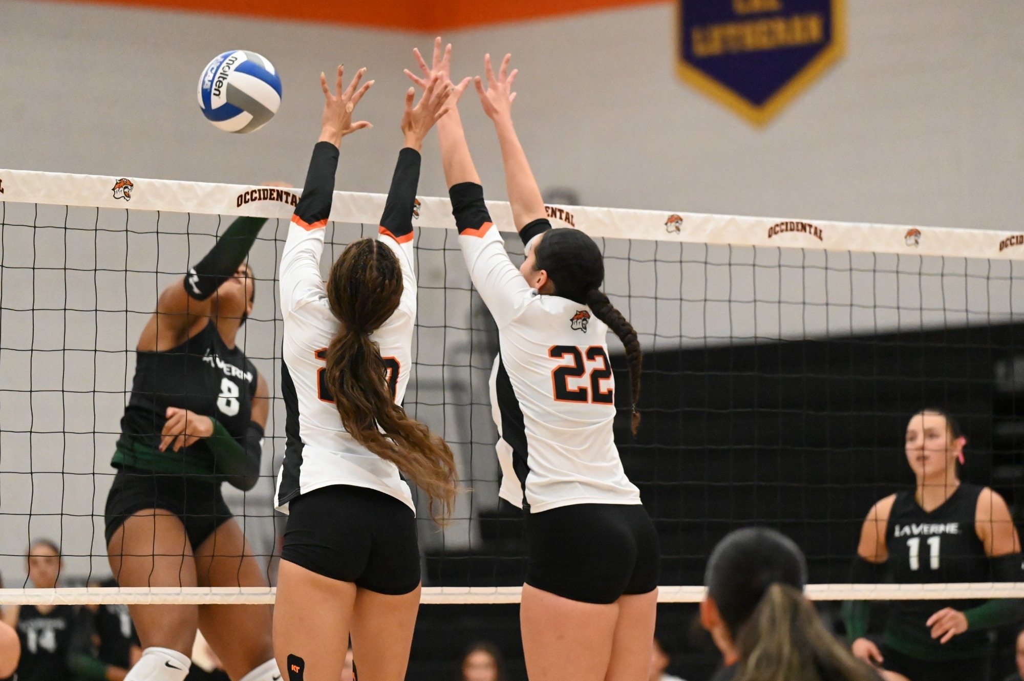 Tigers go up for the block vs. La Verne