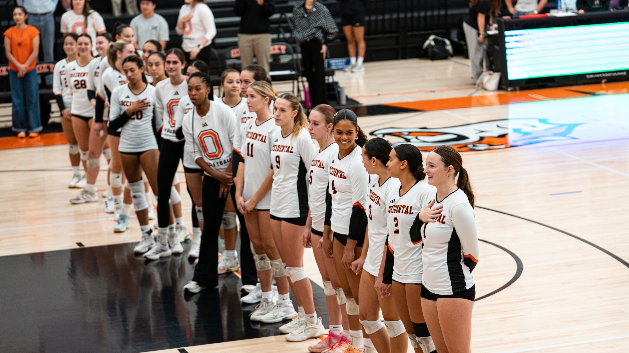Women’s volleyball team lined up for national anthem