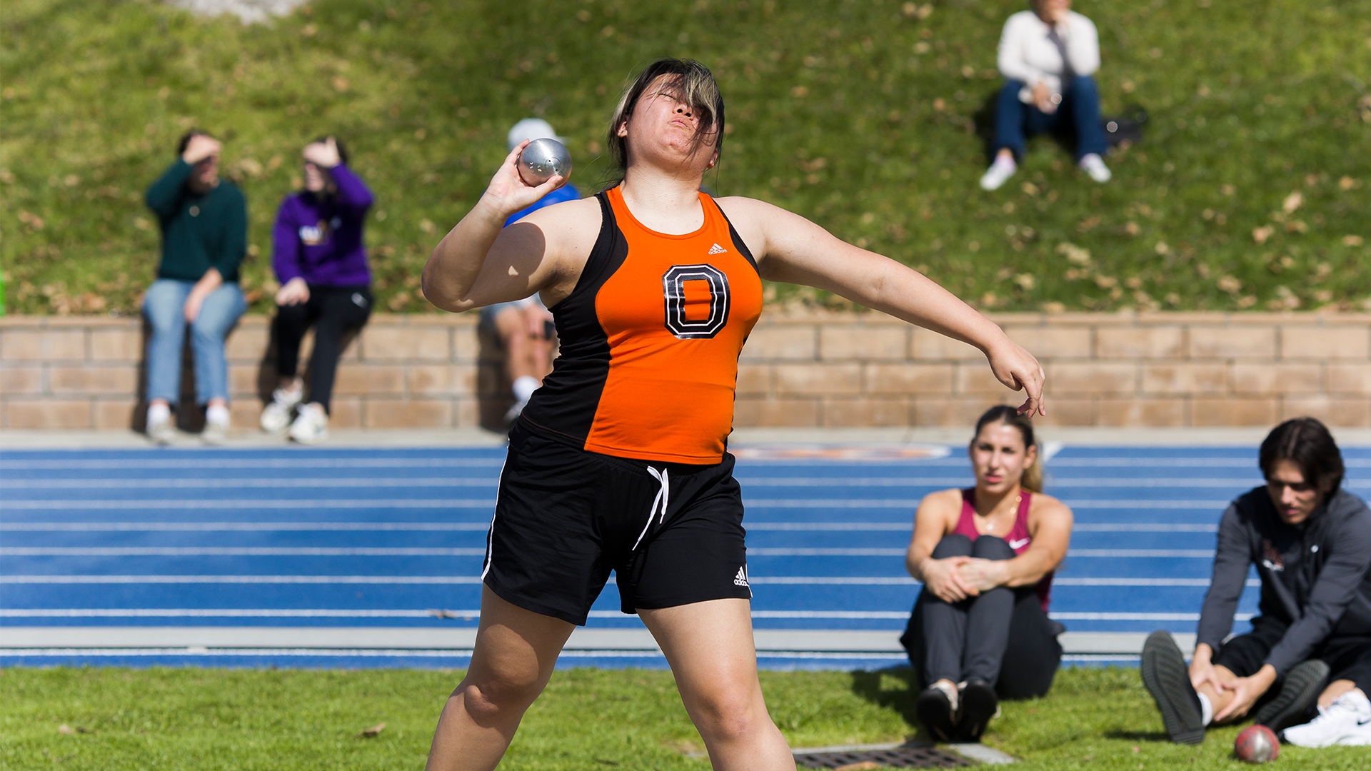 Alexandra Lee throws the shot put