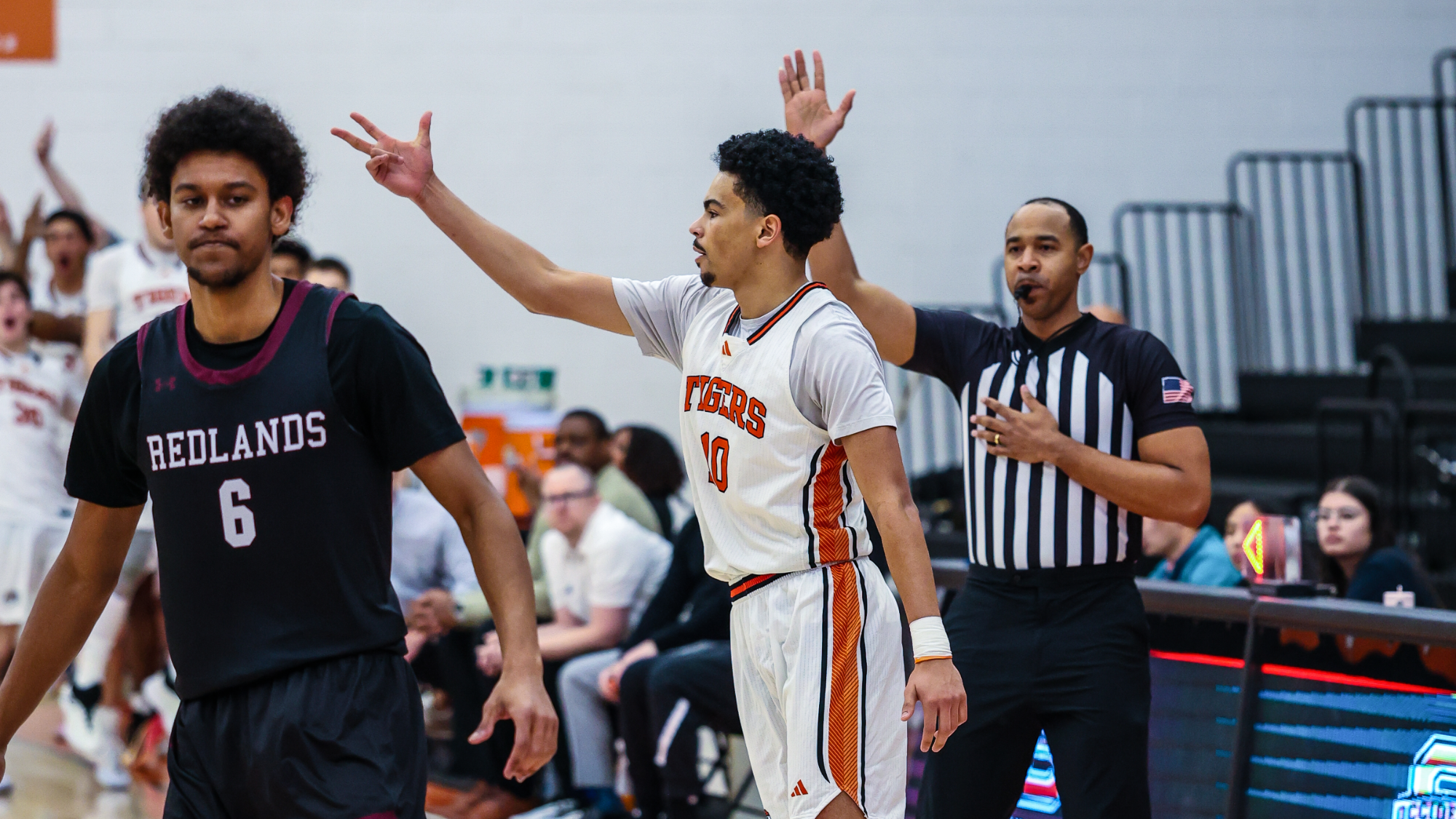 Nasir Luna celebrating a three pointer
