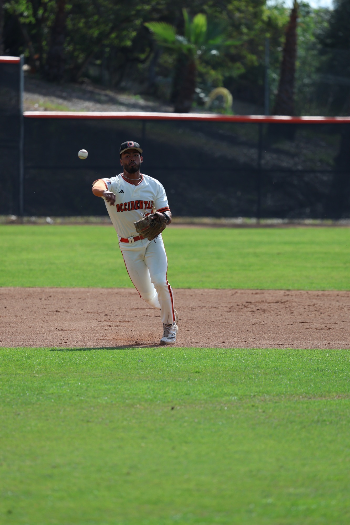 Evann Smith makes a throw to first