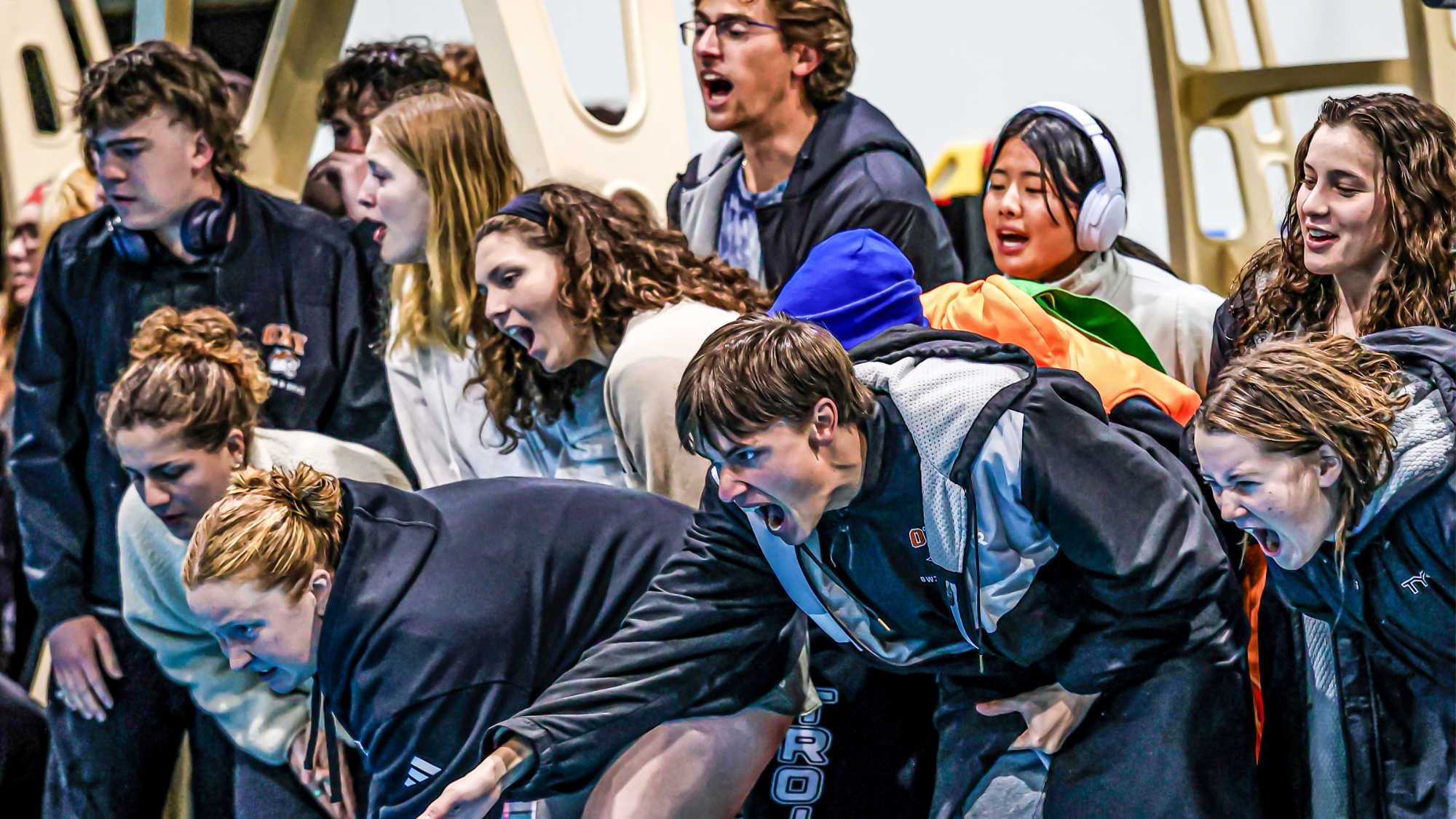 swim cheering on a swimmer in a lane