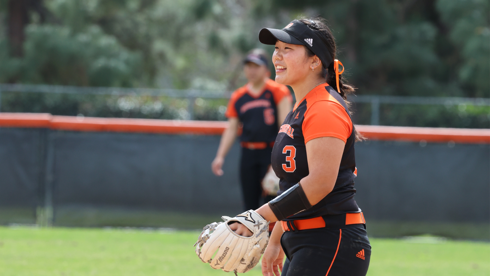 Sophia Siu smiles at the pitcher