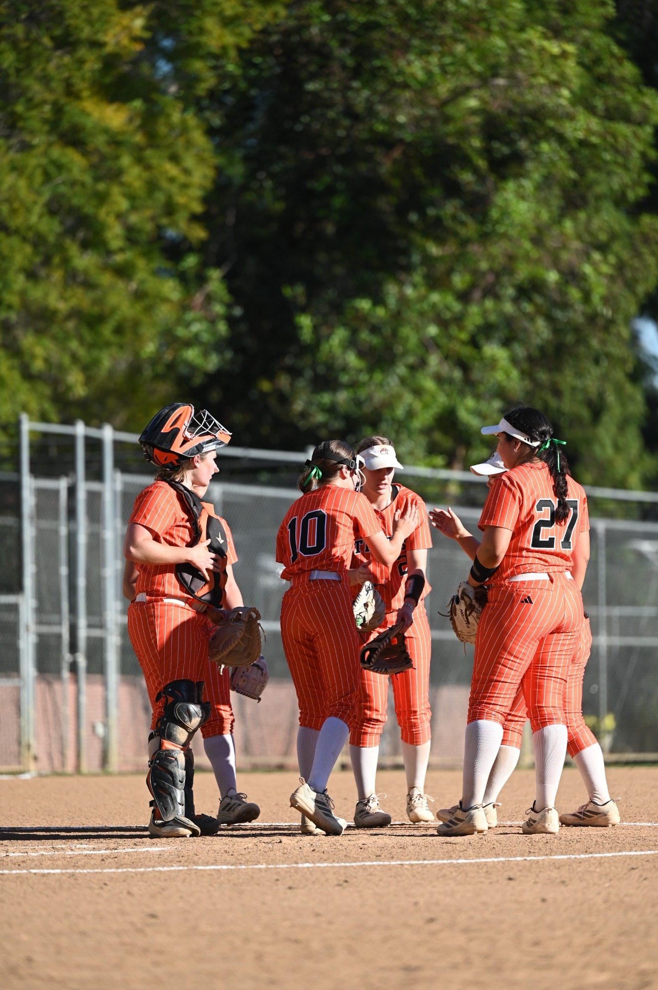 Team huddle at the mound