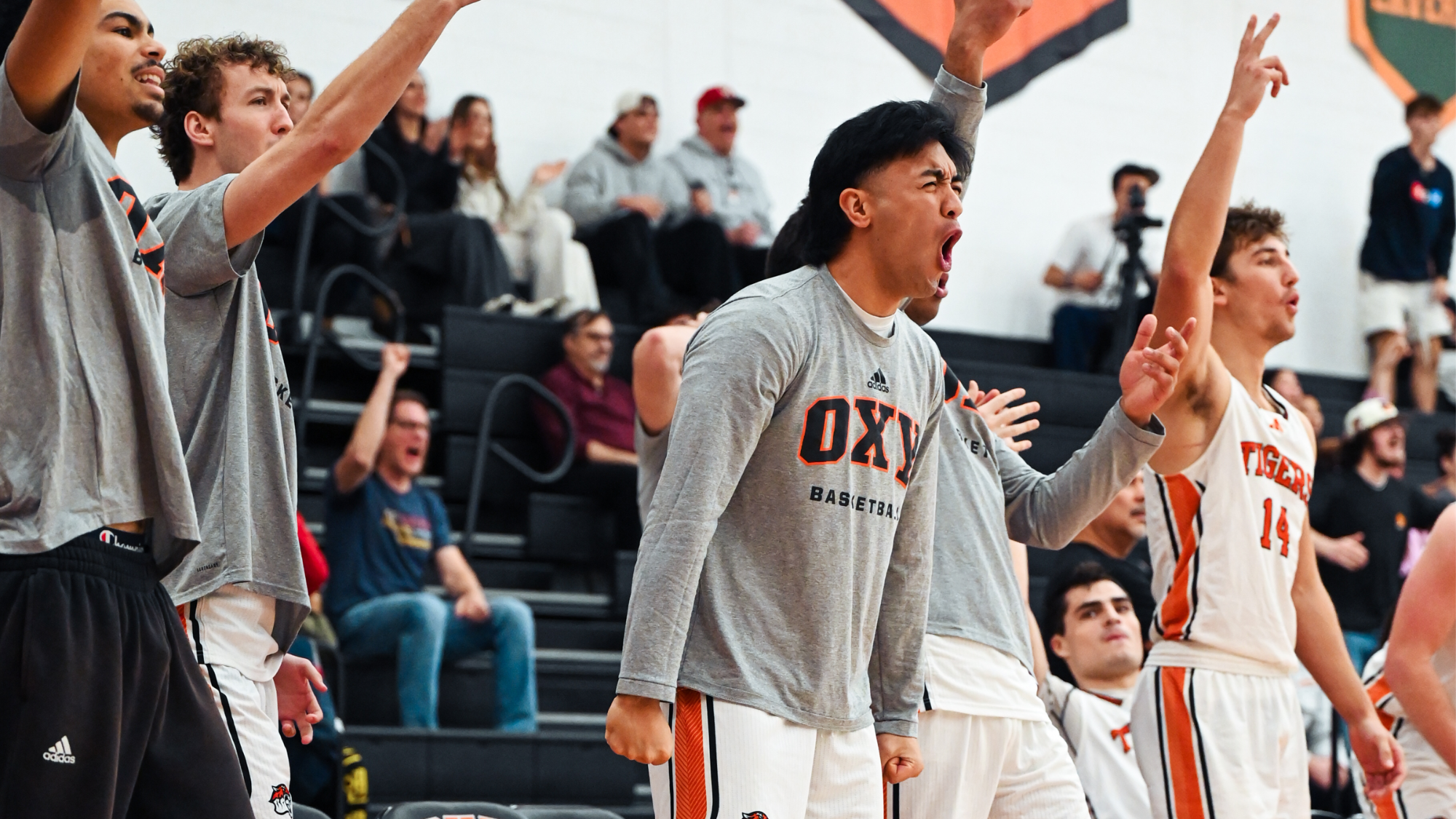 Men's basketball celebrates a 3 pointer