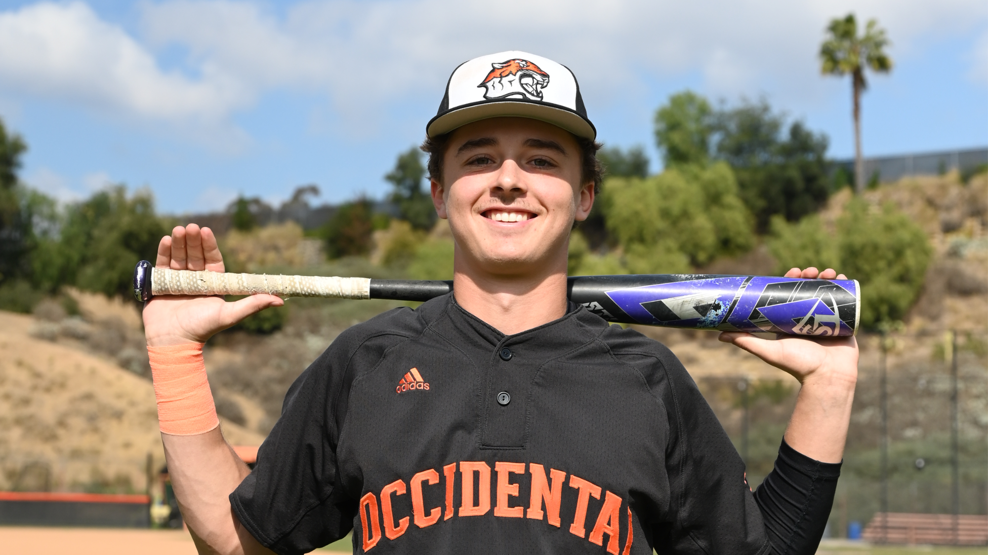 Griffen Rogers posing with a bat