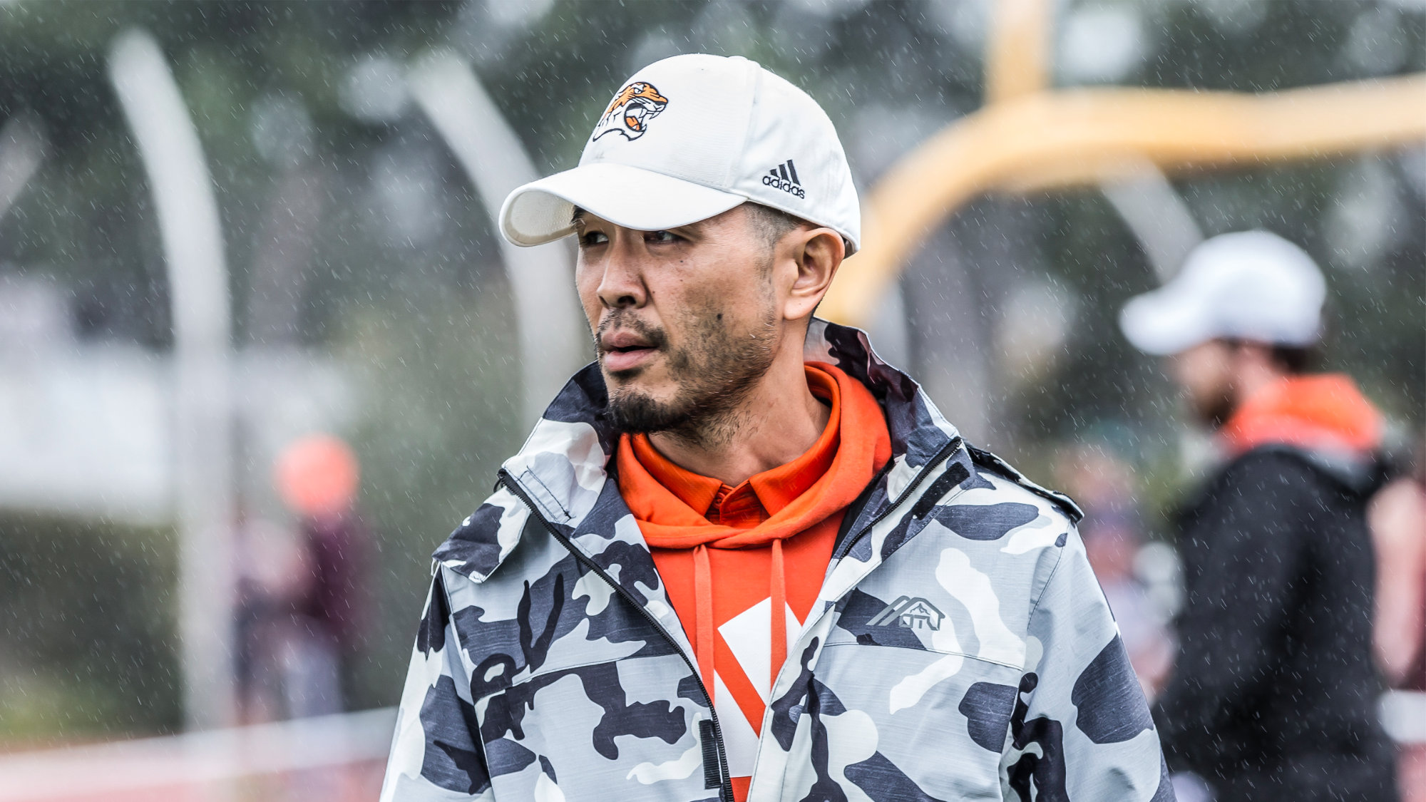 Tyler Yamaguchi looking on as his athletes compete