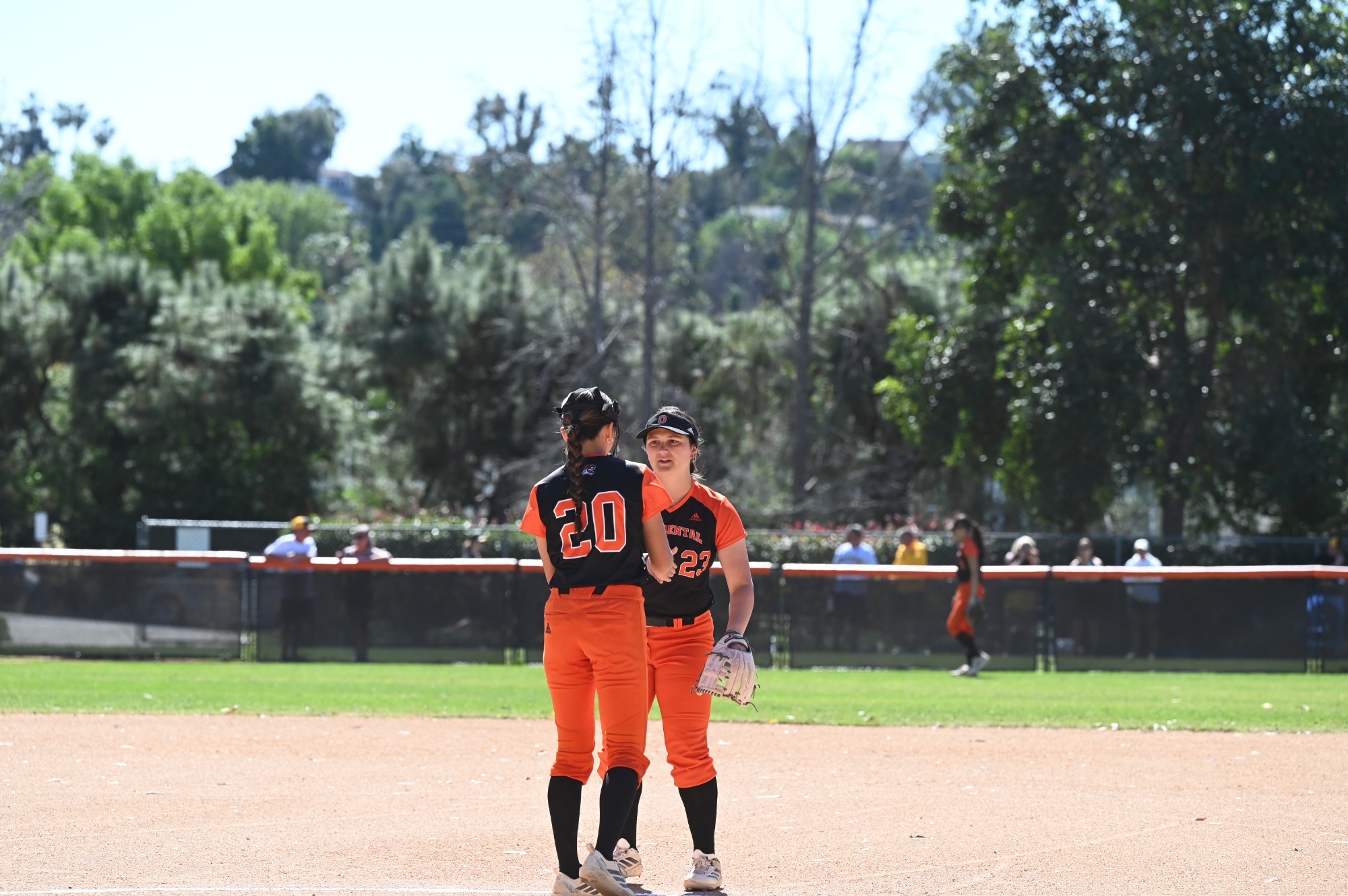 Lehua Acoba and Kadence Bernard meet at the mound