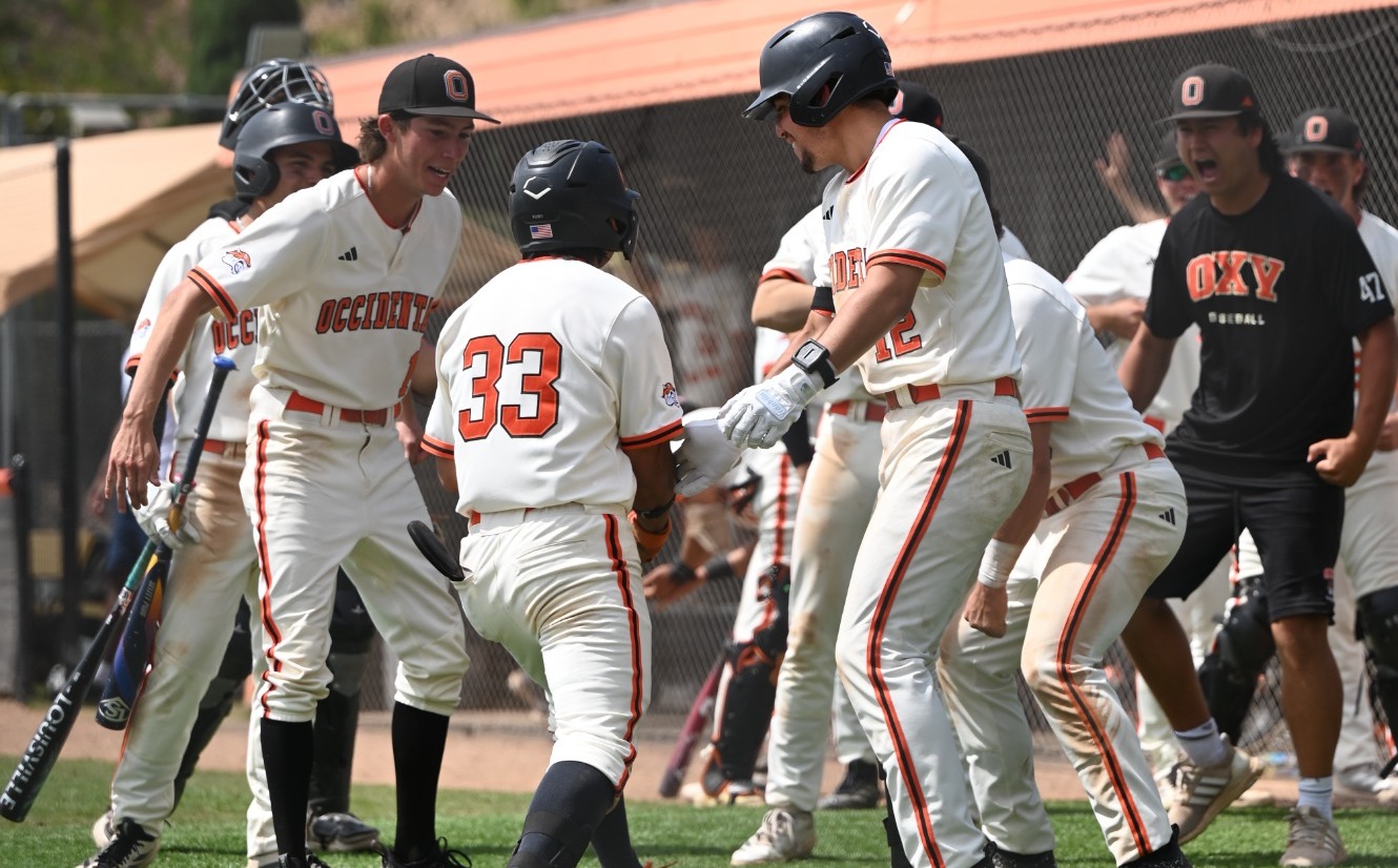 Tyler Kubo celebrates him HR with the team