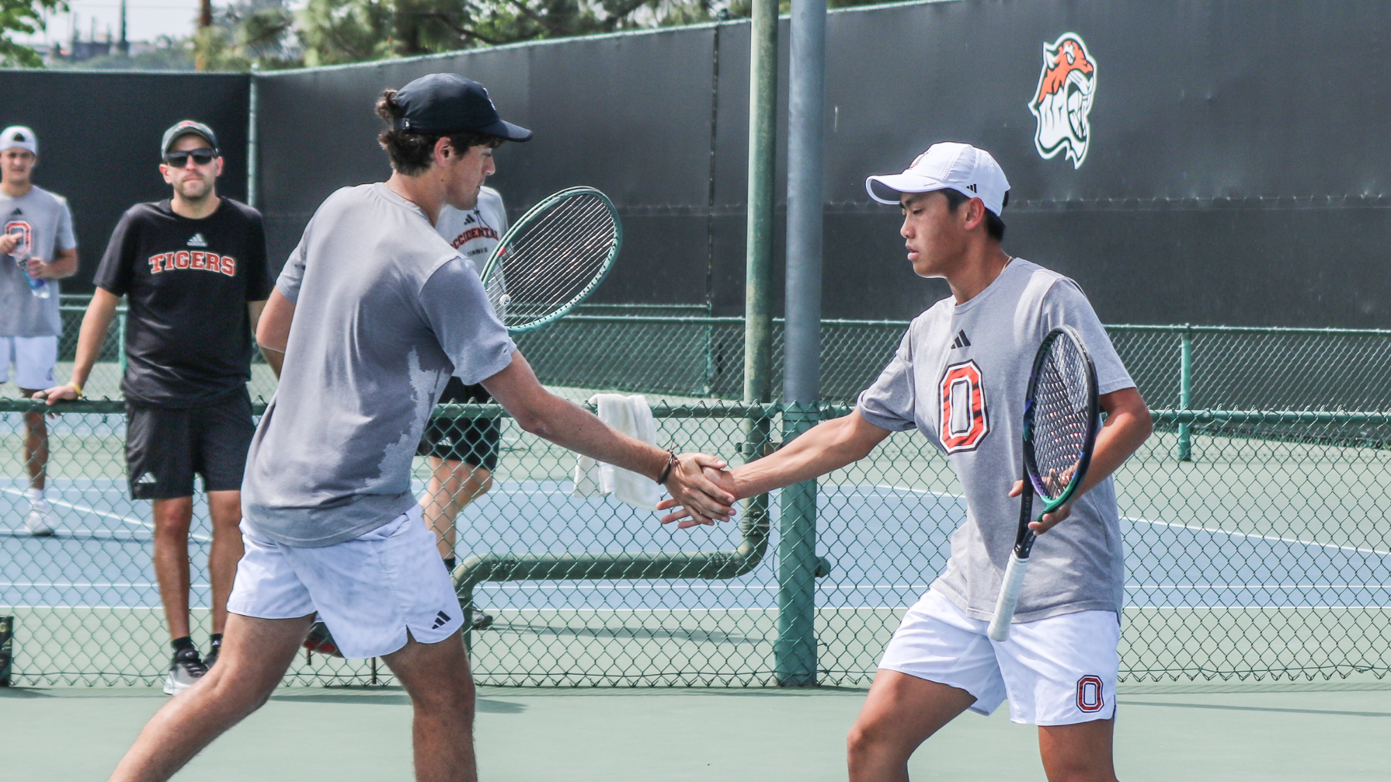 Ronald Chen and Ace Andres give each other high fives