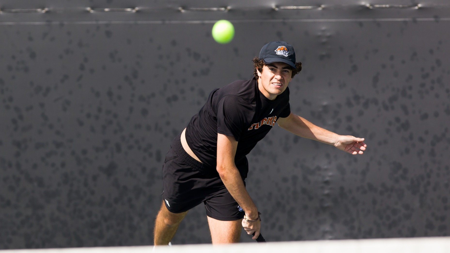 Ace Andres hits a serve