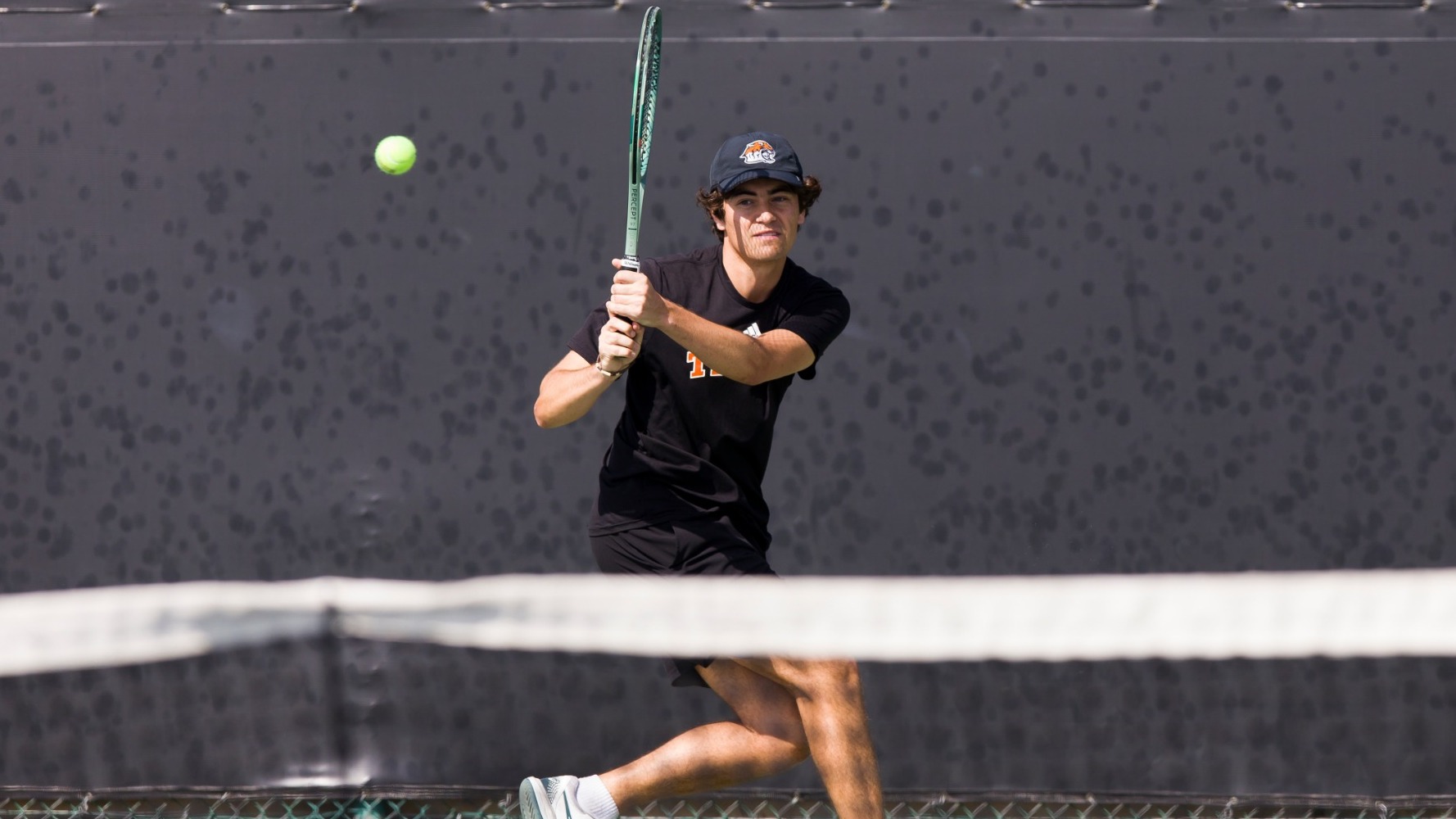 Ace Andres hits a backhand
